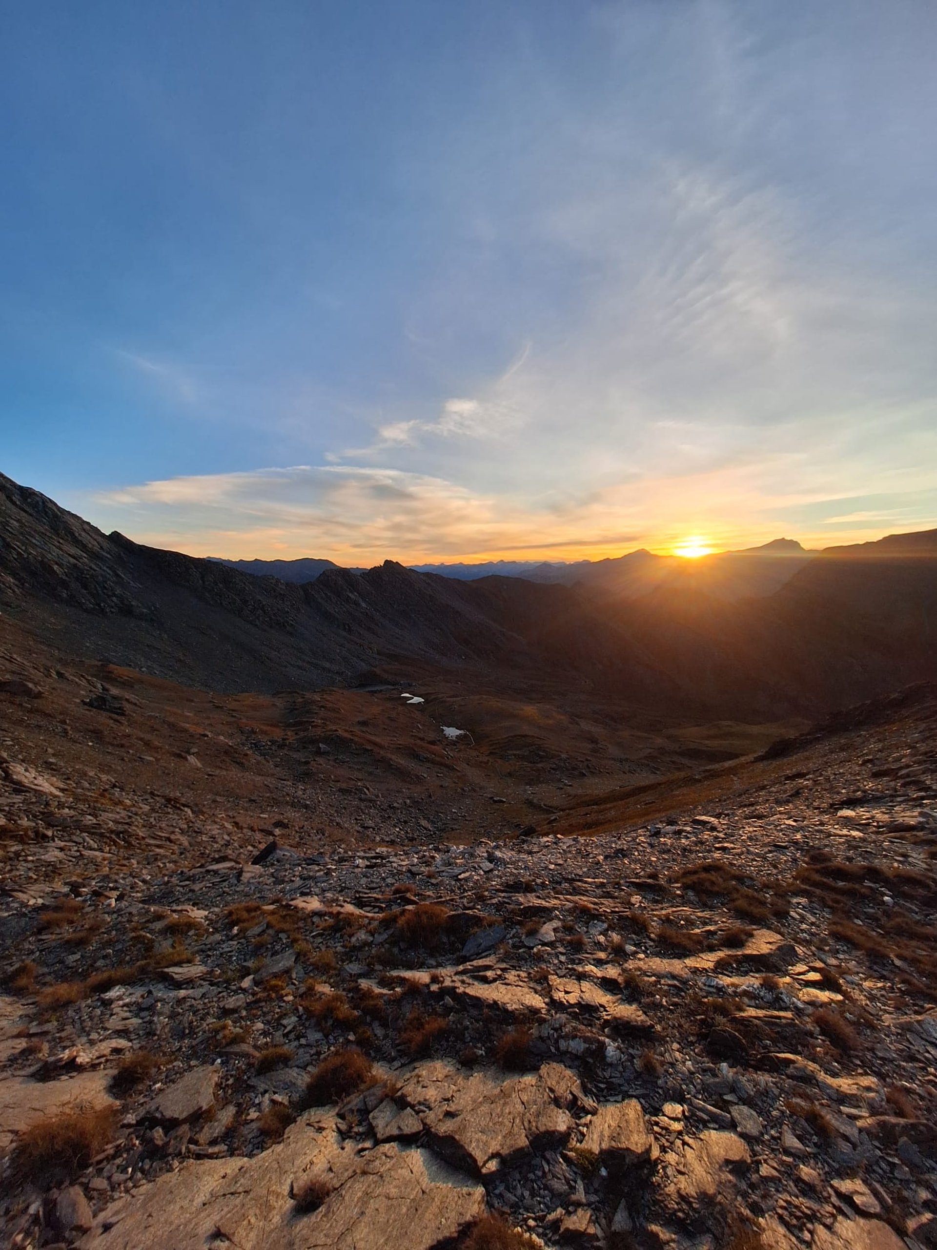 an abstract photo of a curved building with a blue sky in the background