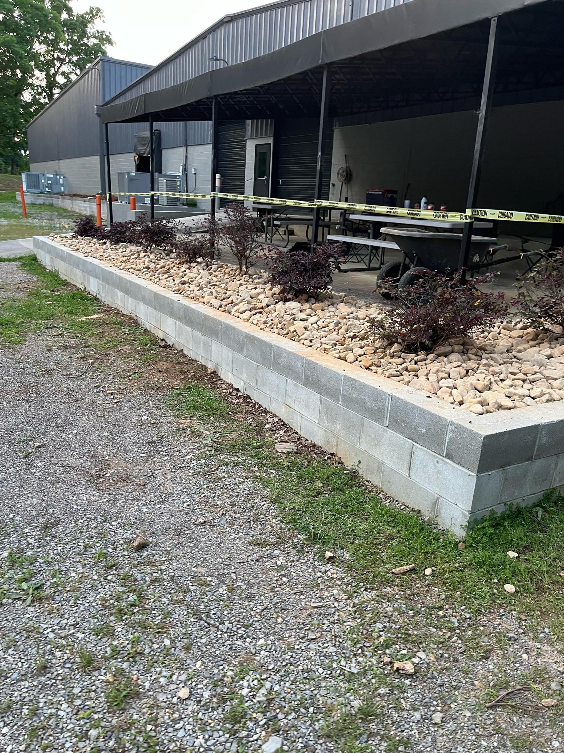 retaining wall holding rock and plants
