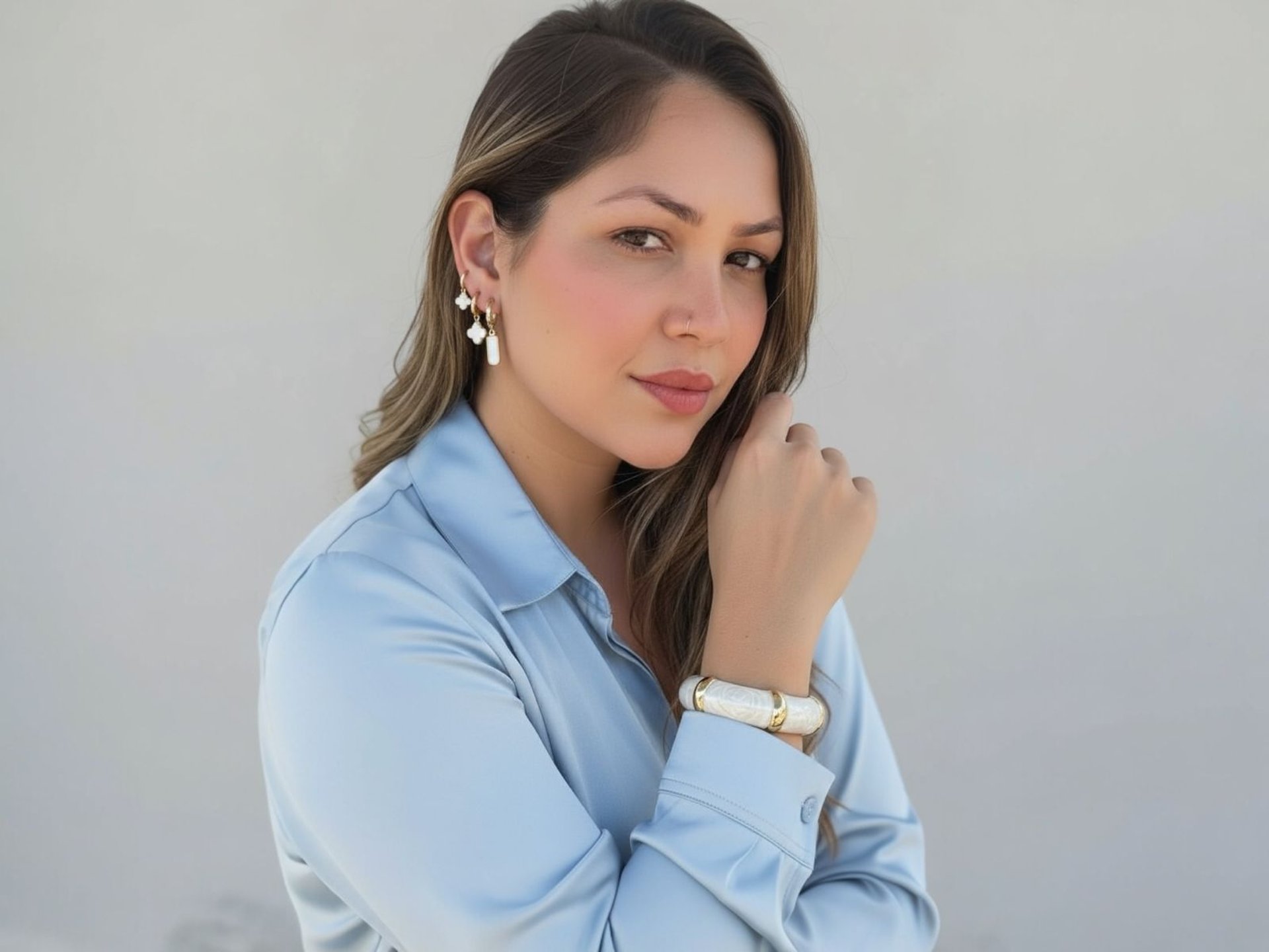 a woman with her hand on her chin