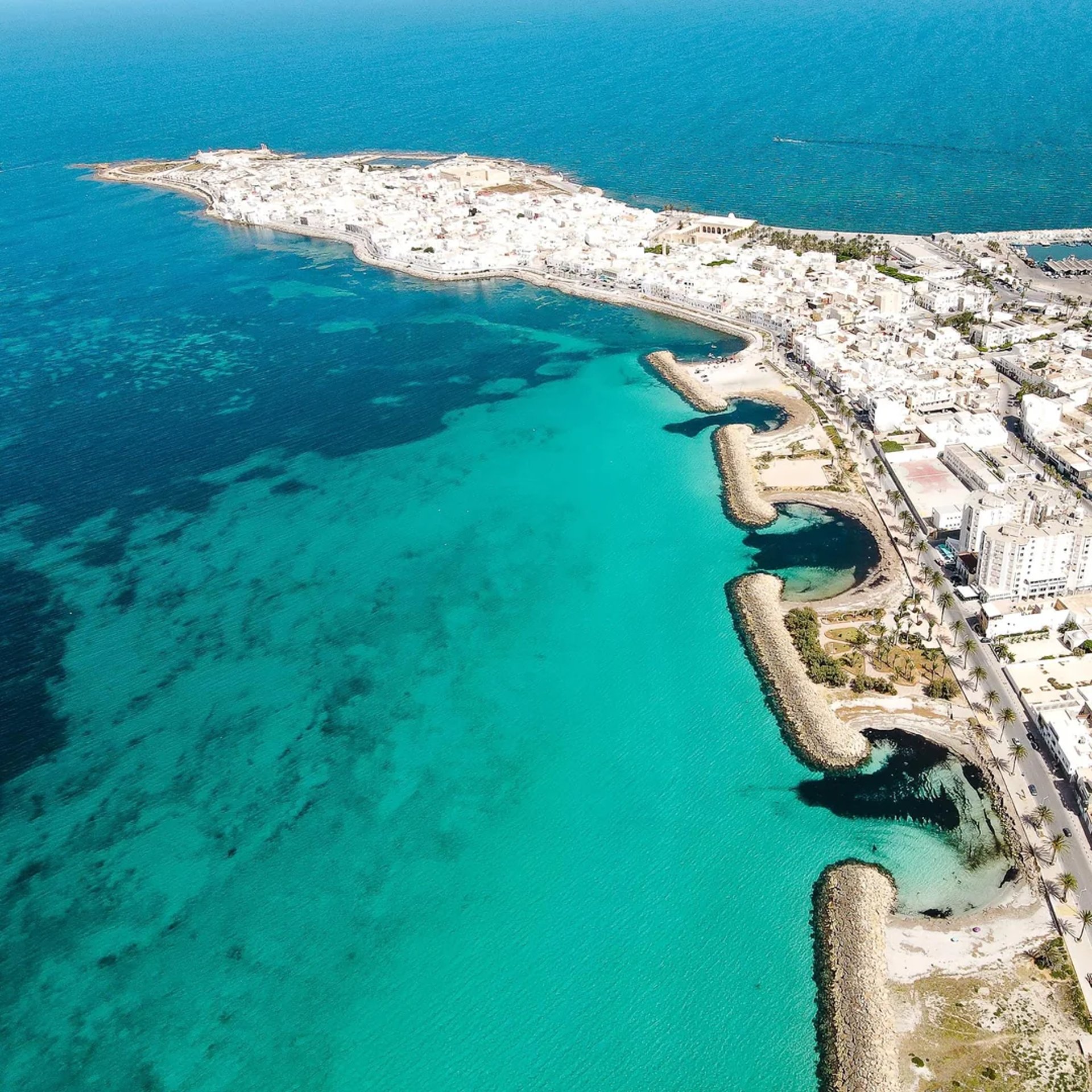 woman wearing yellow long-sleeved dress under white clouds and blue sky during daytime