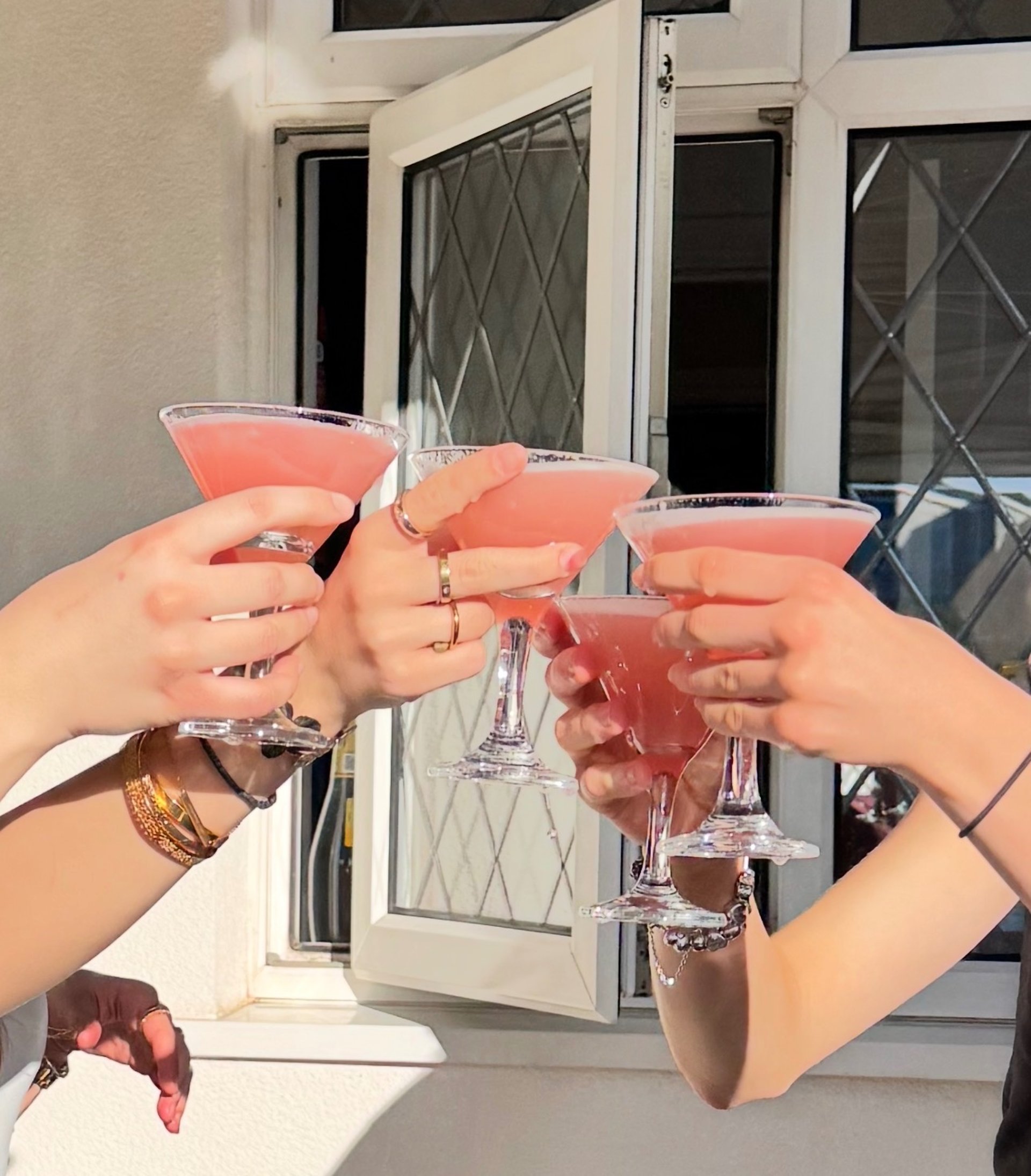 a group of people holding drinks