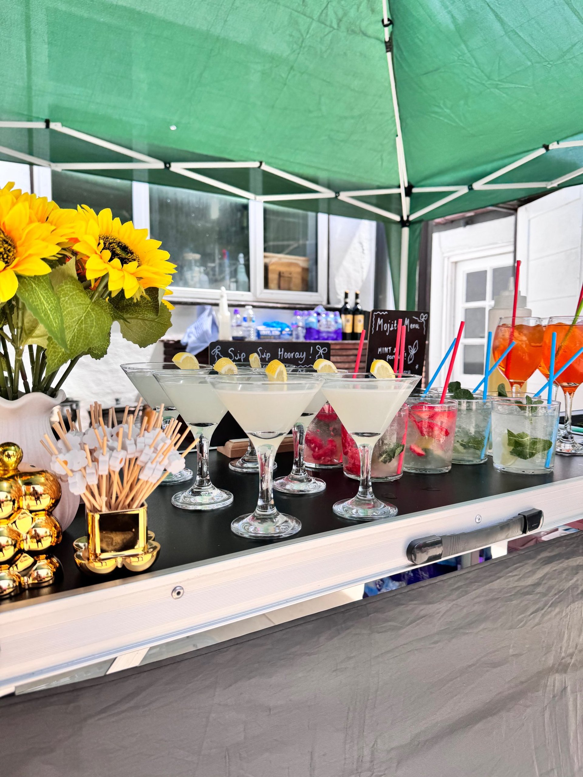 brown wooden bar stools with bottles