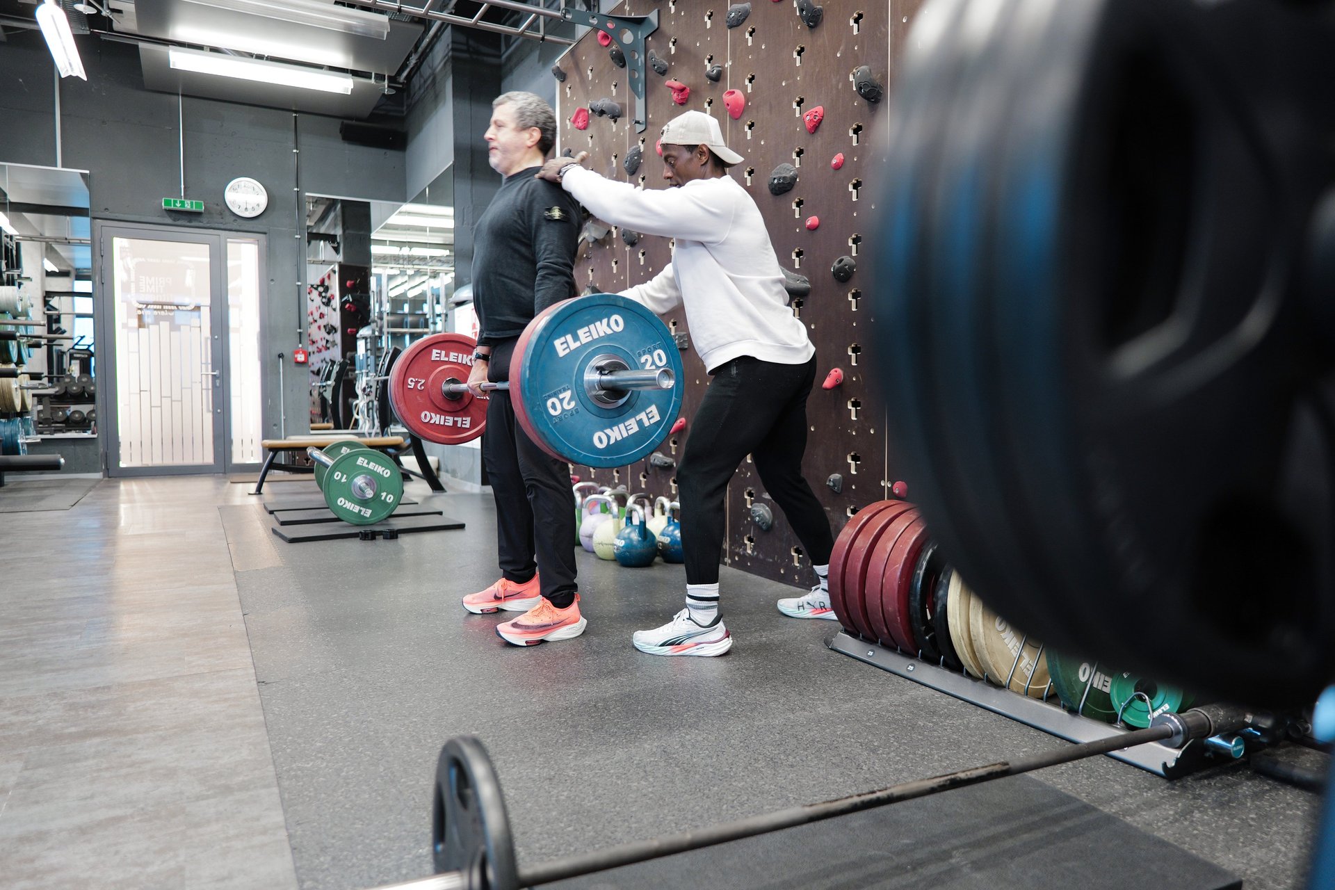 an abstract photo of a curved building with a blue sky in the background