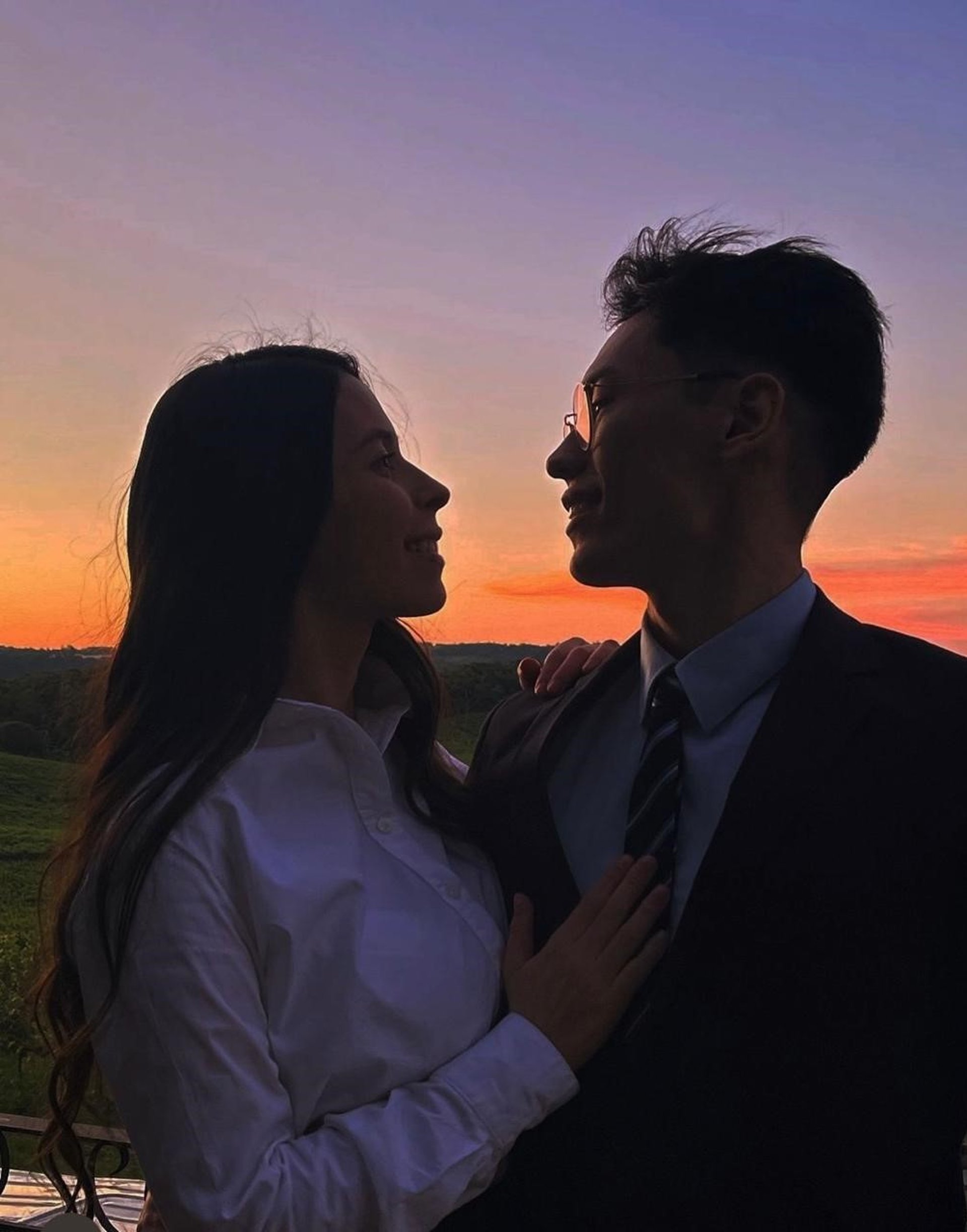 couple wearing silver-colored rings