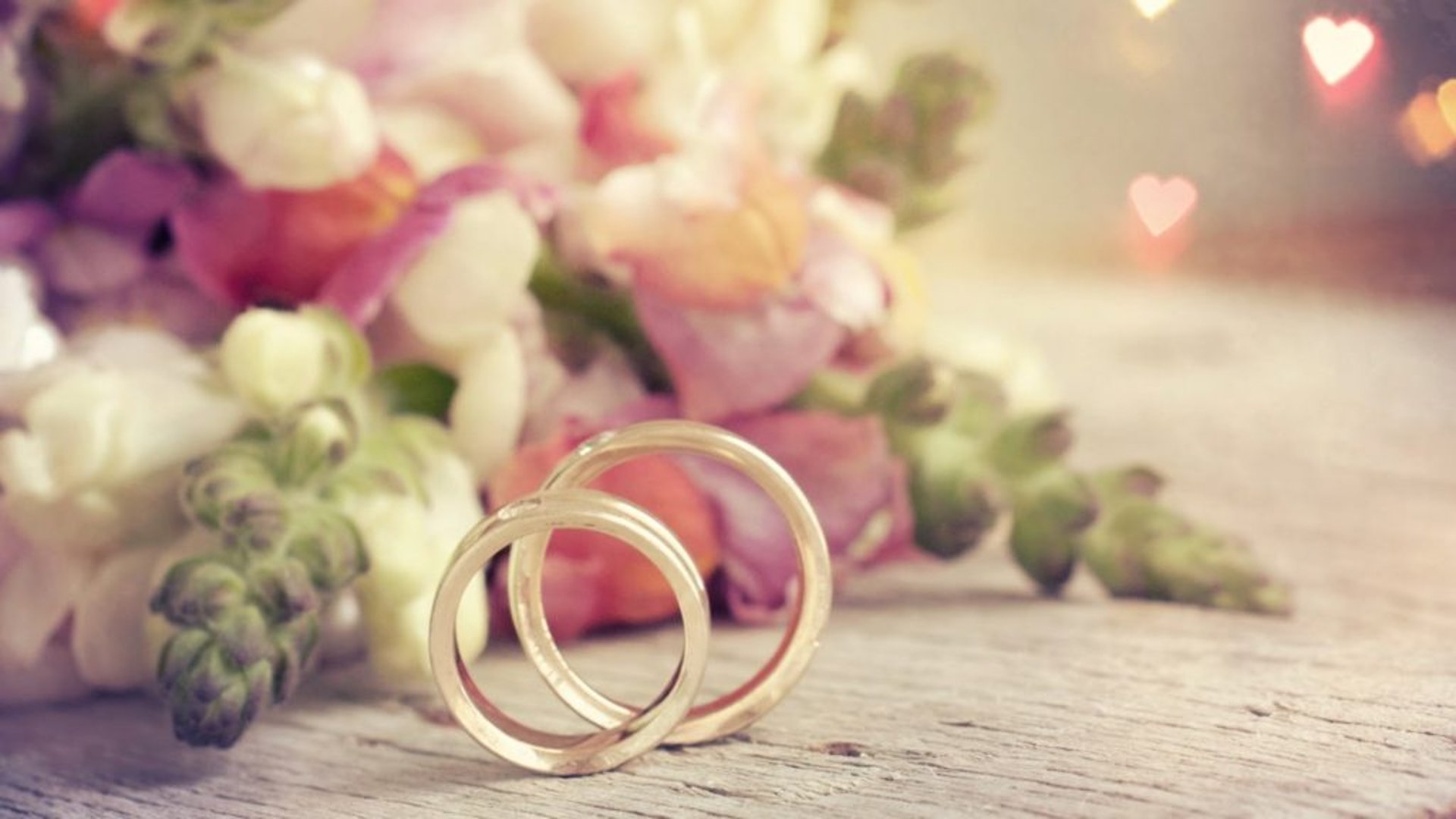 couple wearing silver-colored rings