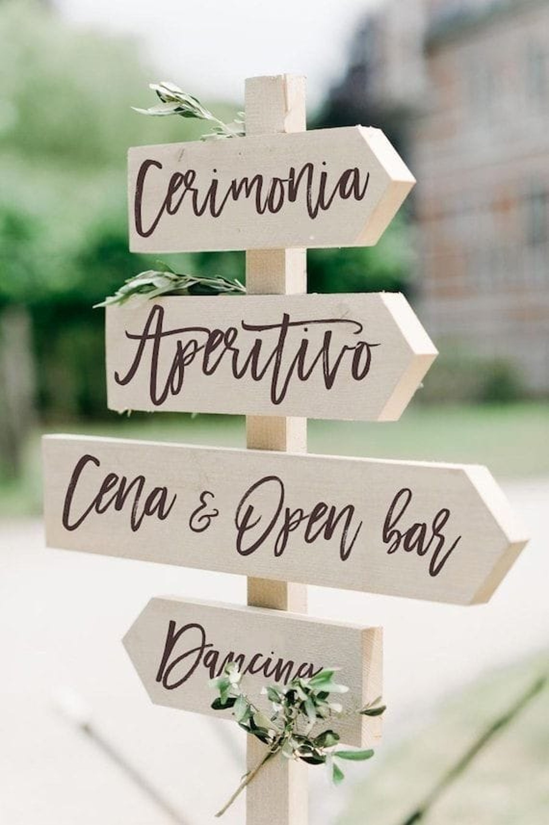 red and white eat, drink, and be married signage near brown tree