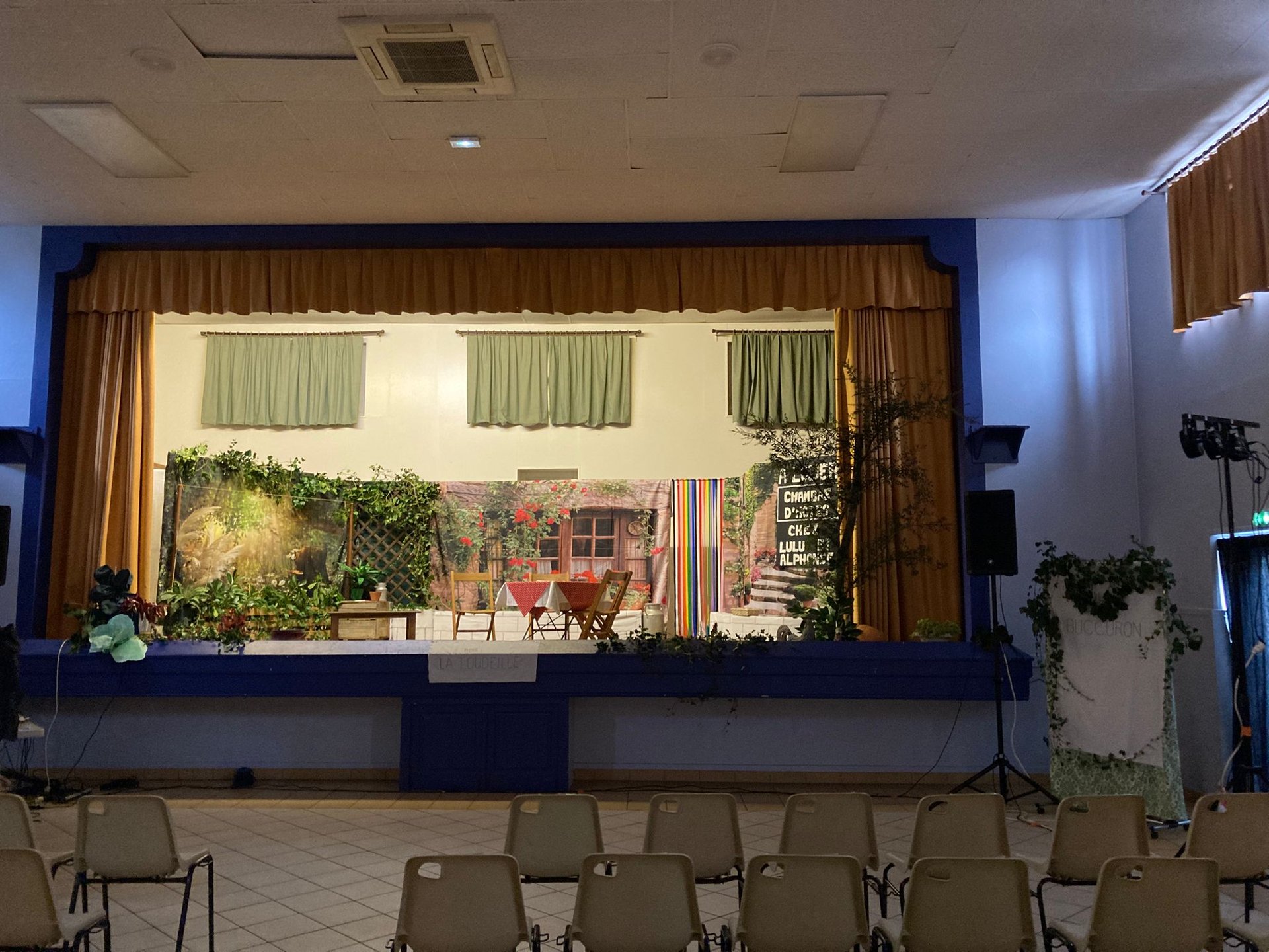 silhouette of three performers on stage