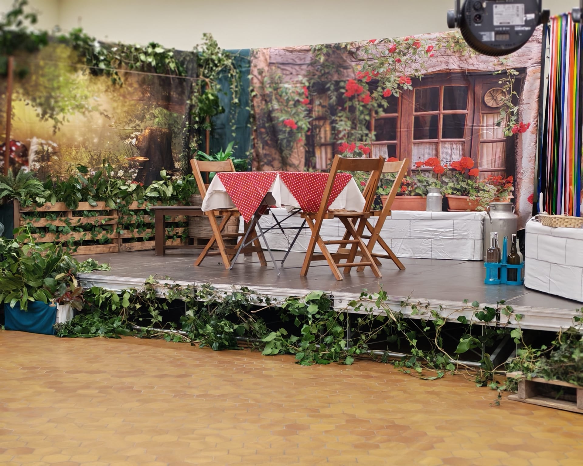 silhouette of three performers on stage