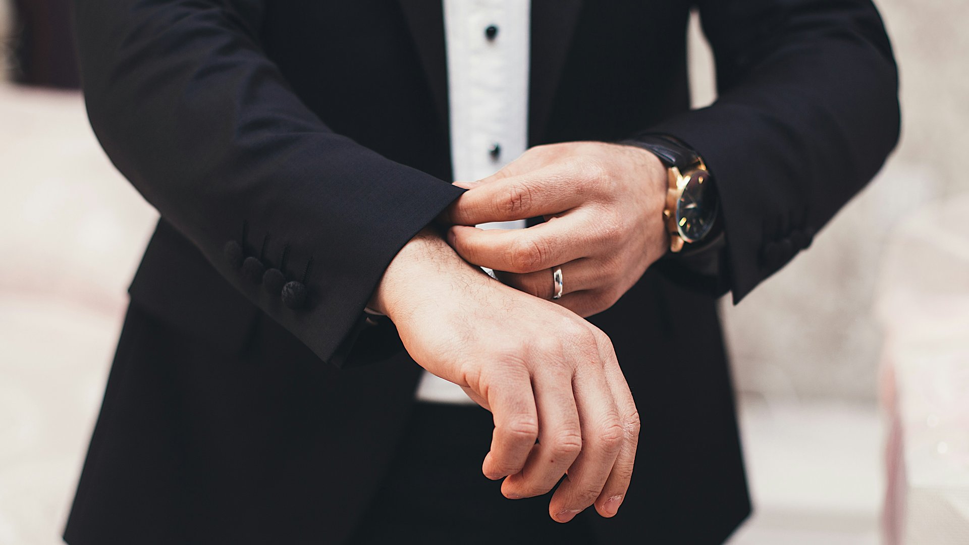 A man in a black suit