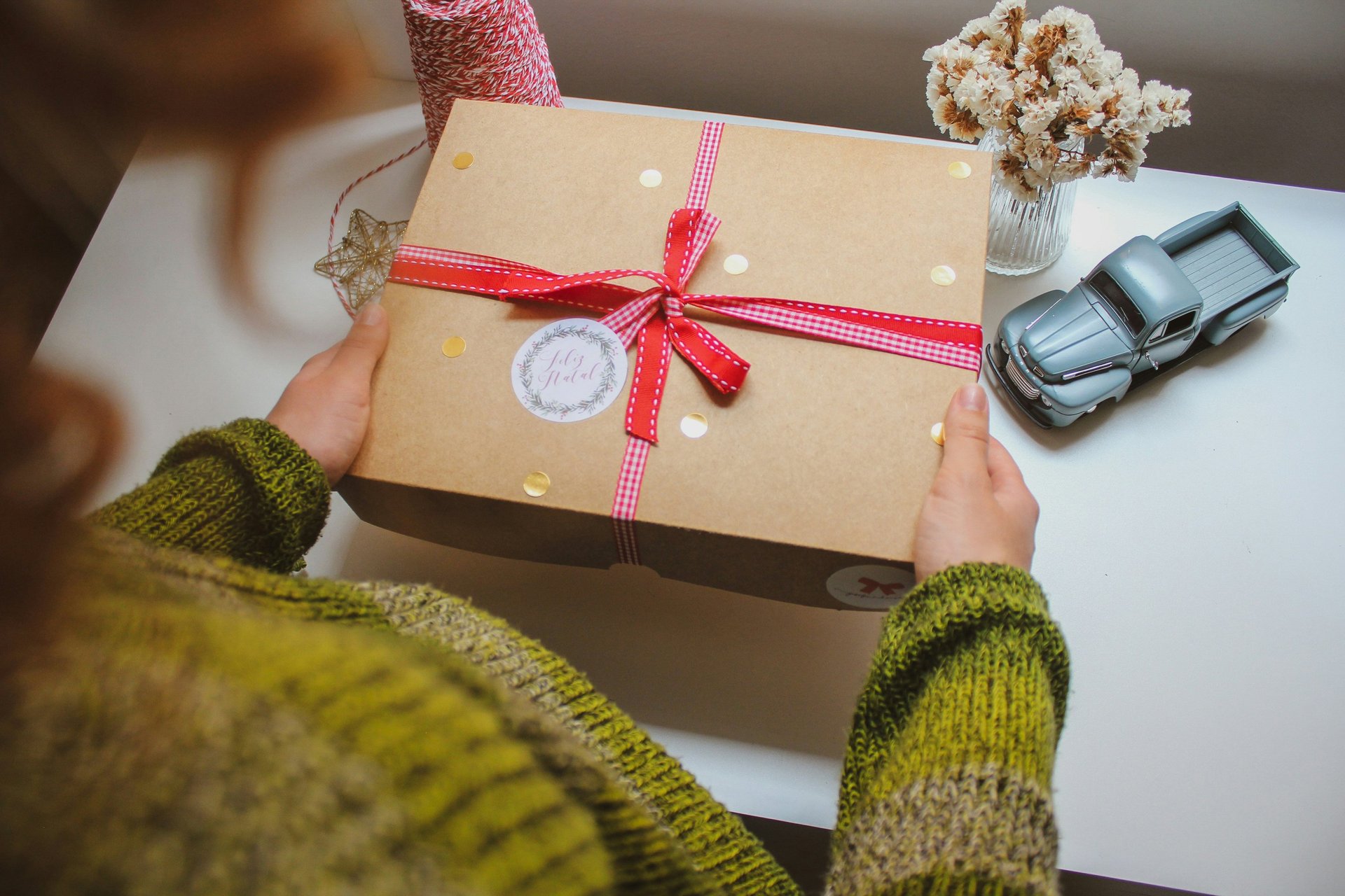 A Girl is holding a gift box