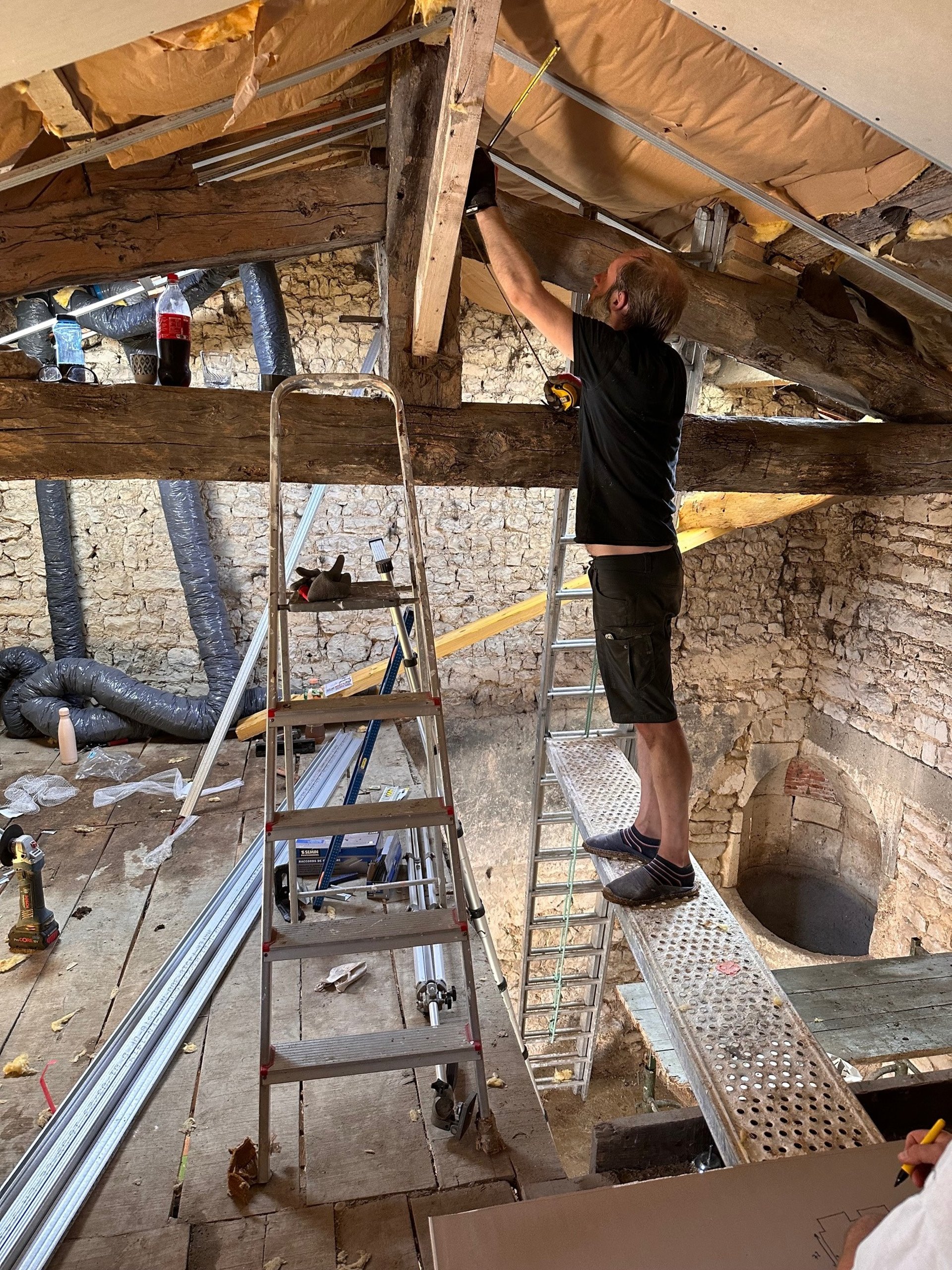 man climbing on ladder inside room