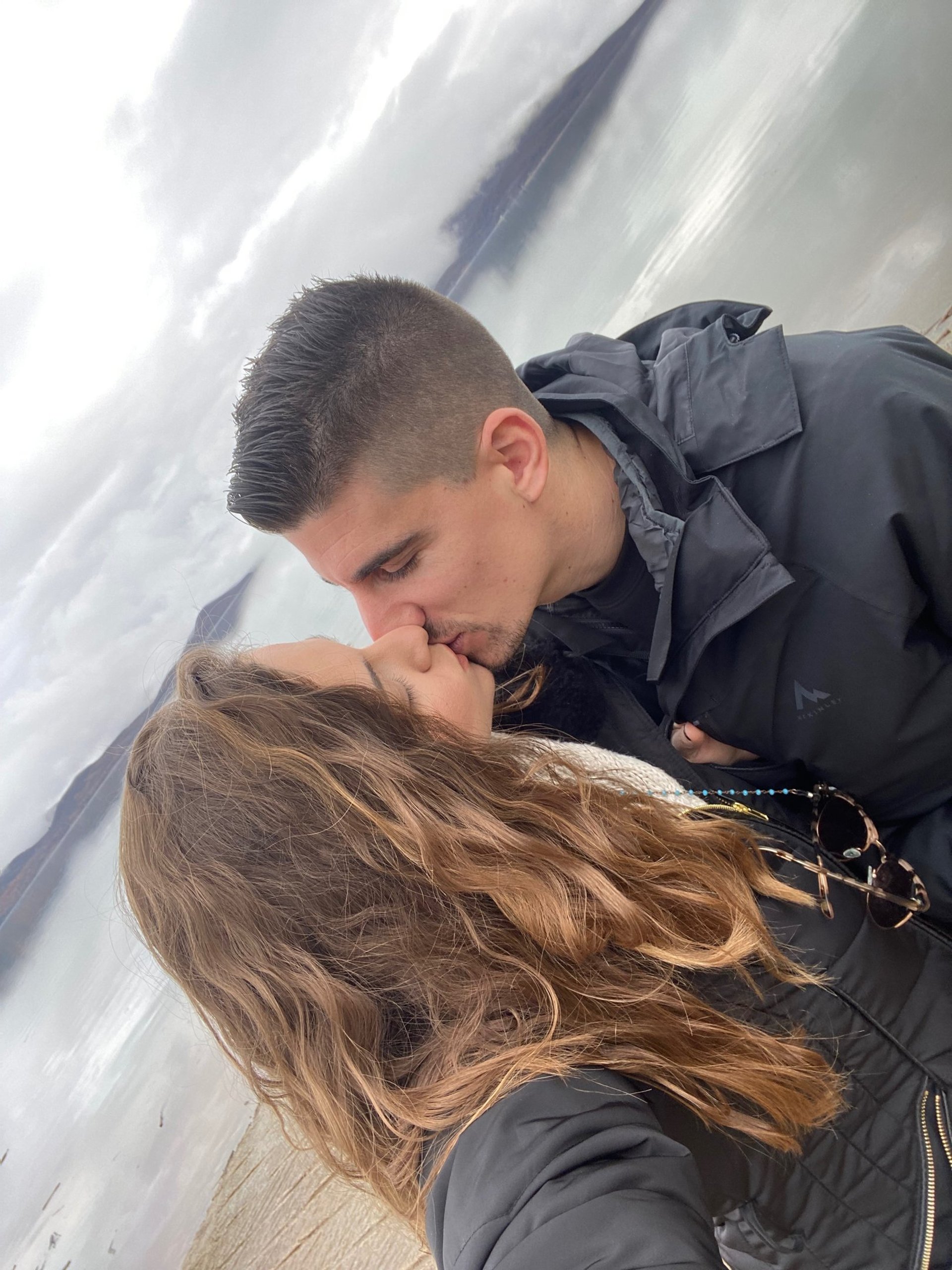 couple wearing silver-colored rings