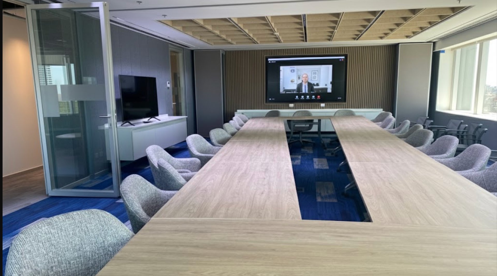 an abstract photo of a curved building with a blue sky in the background