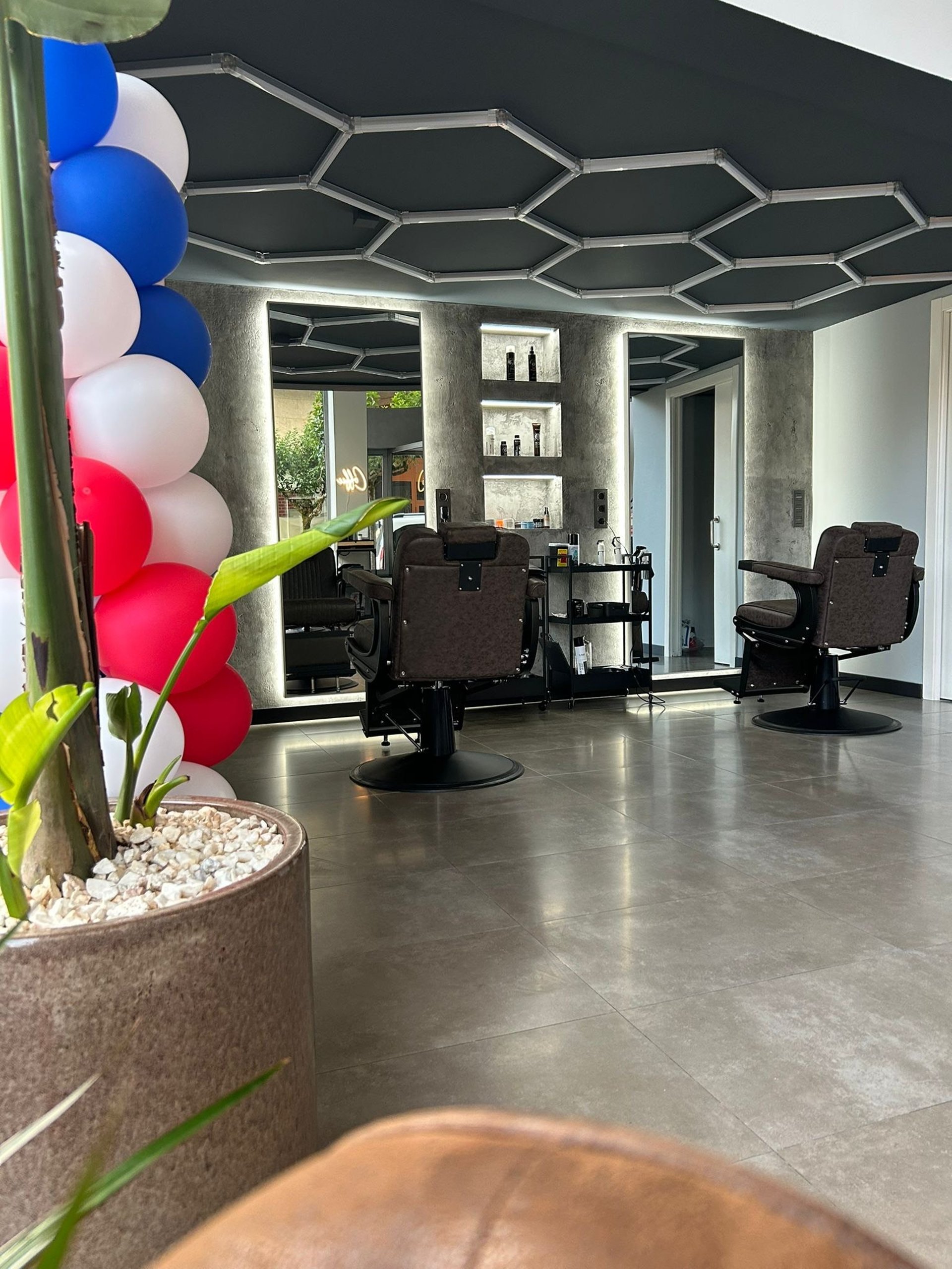 an abstract photo of a curved building with a blue sky in the background