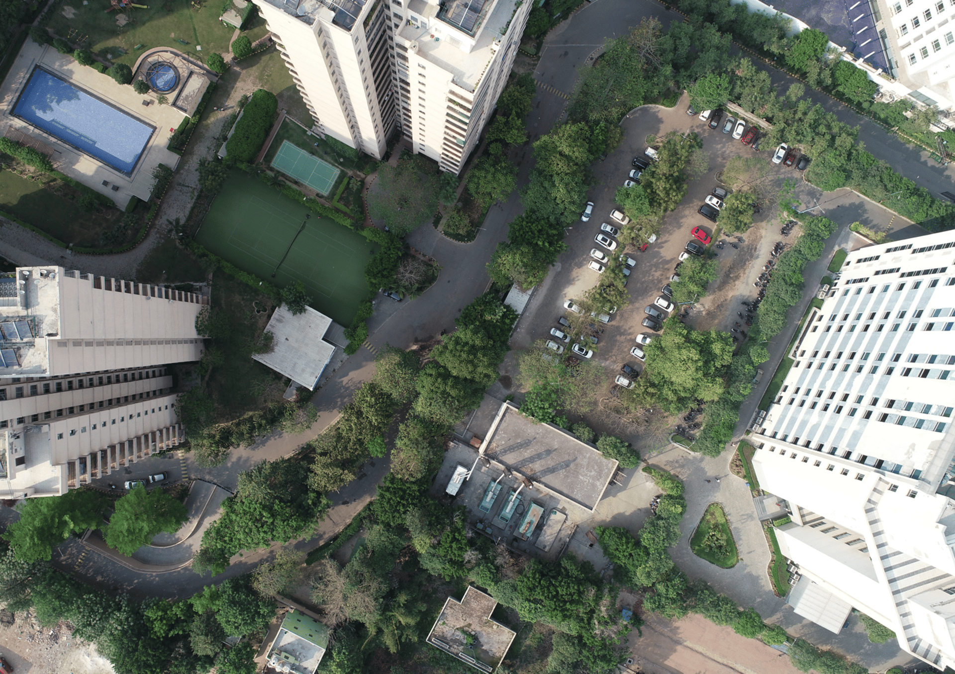 an aerial view of a city with tall buildings