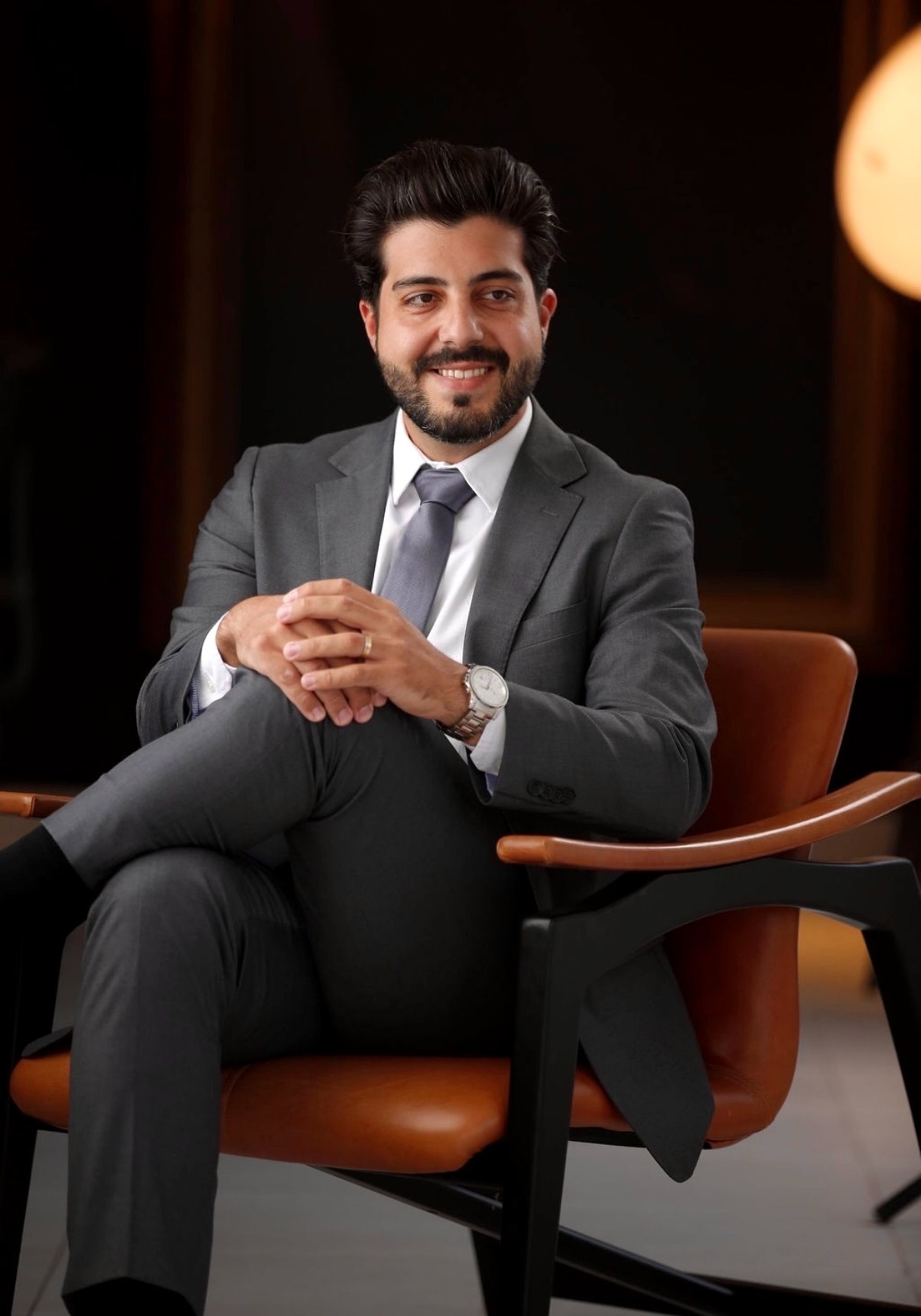 an abstract photo of a curved building with a blue sky in the background