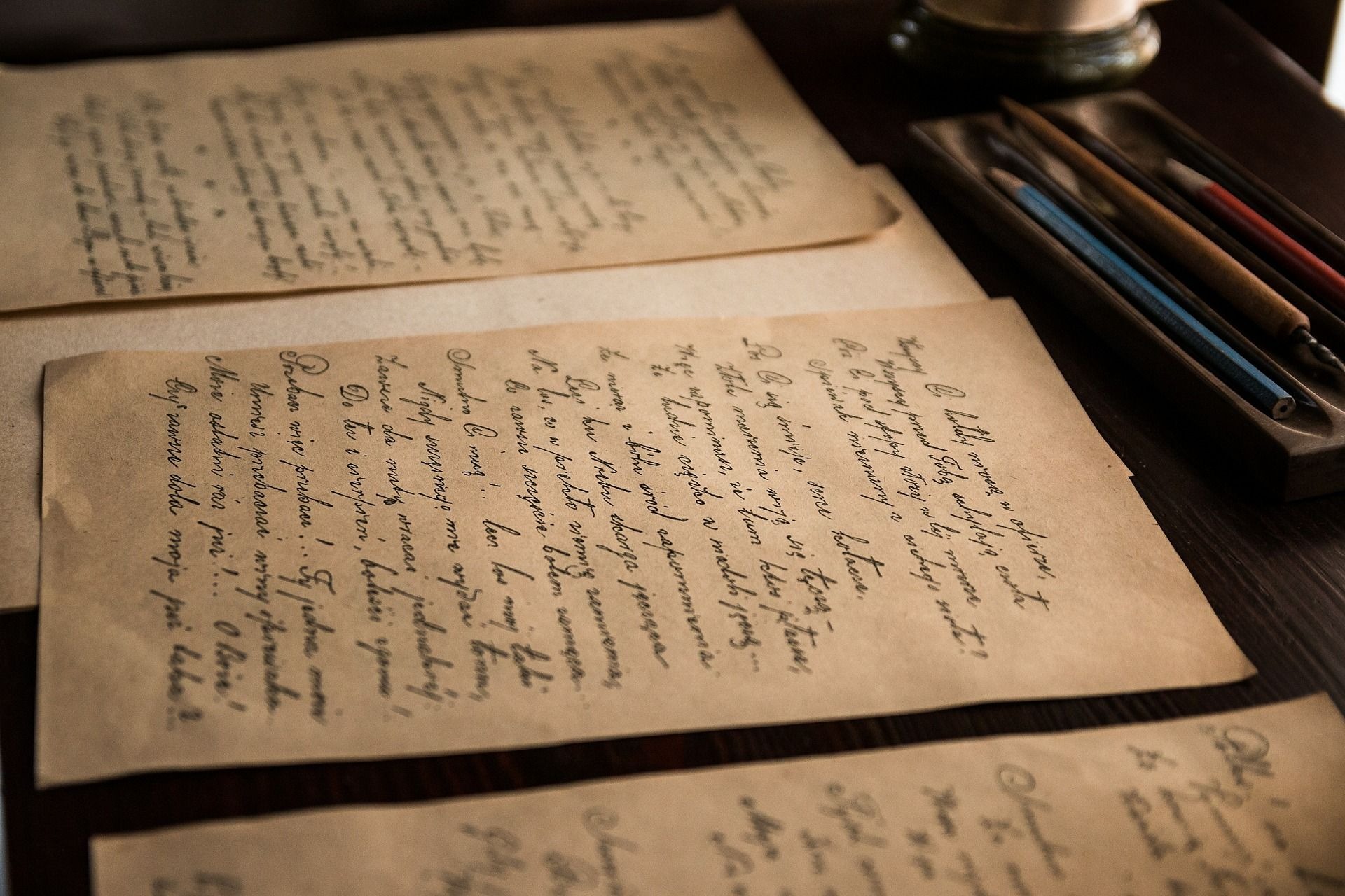 old paper with writing covering them