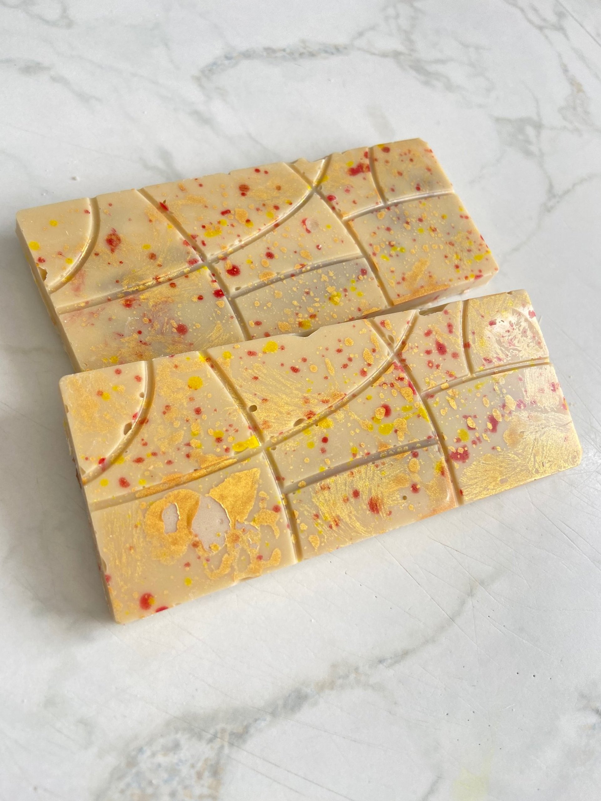 chocolates with box on white surface