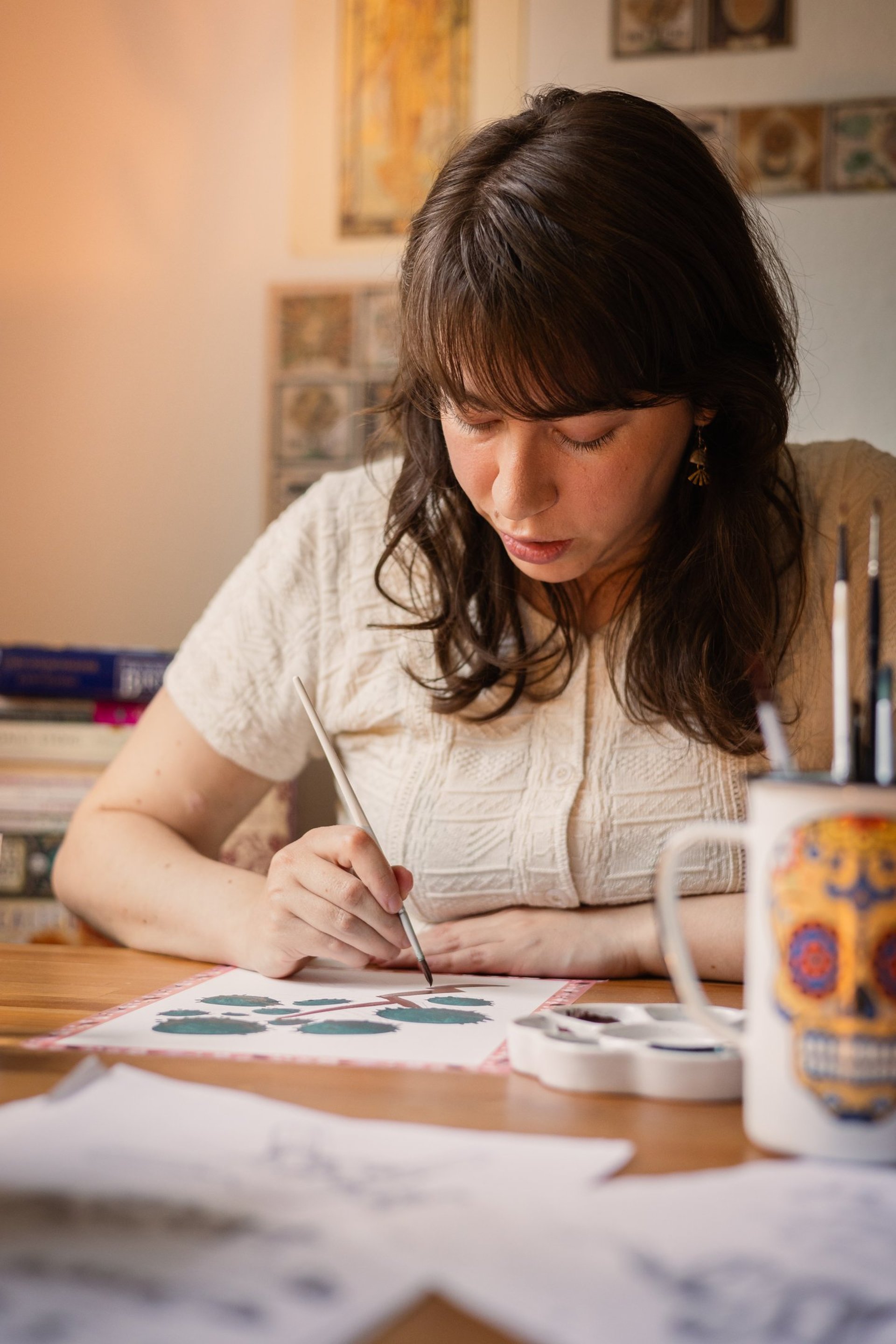 a cup of coffee sitting on top of a white table
