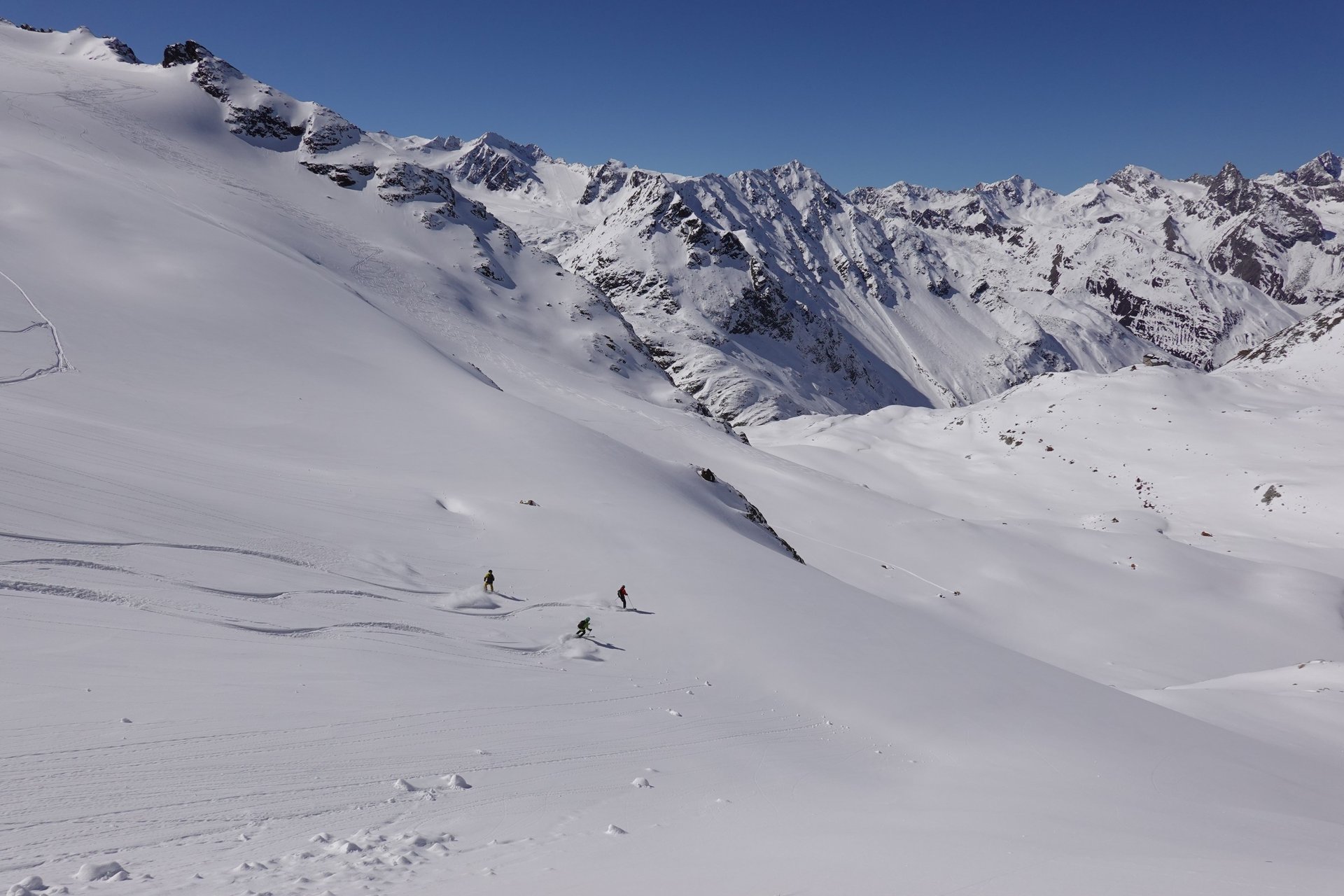 an abstract photo of a curved building with a blue sky in the background