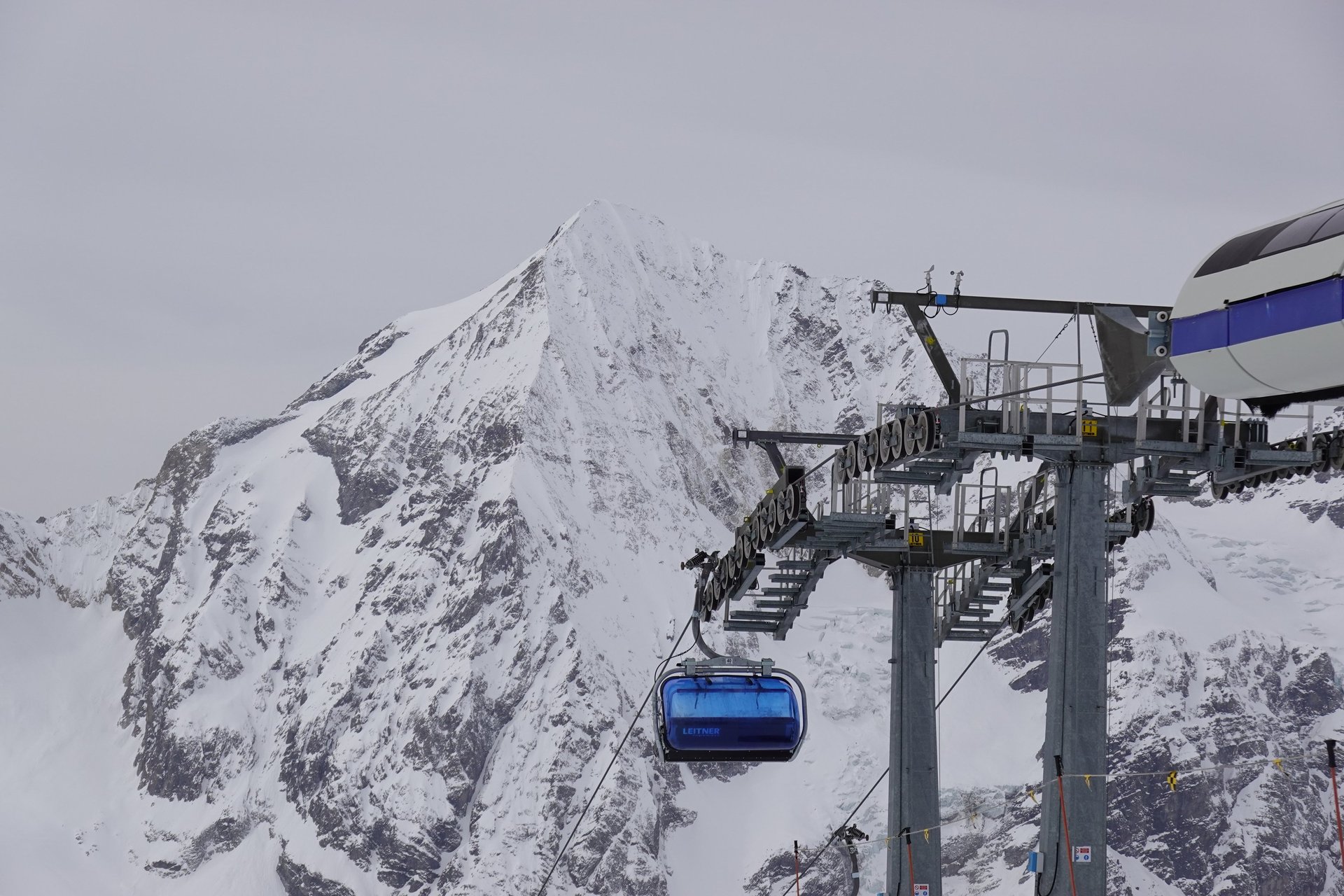 an abstract photo of a curved building with a blue sky in the background