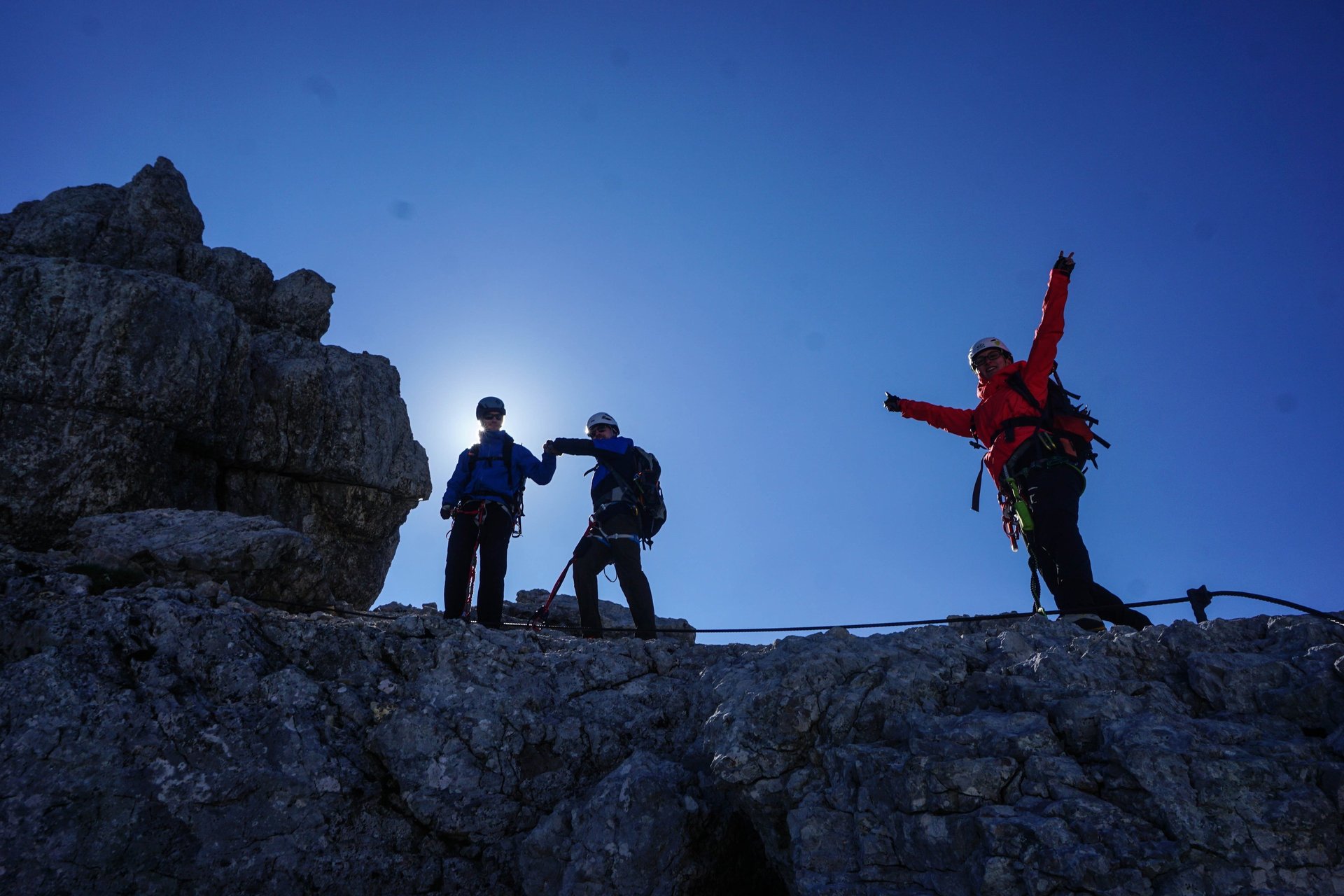 an abstract photo of a curved building with a blue sky in the background