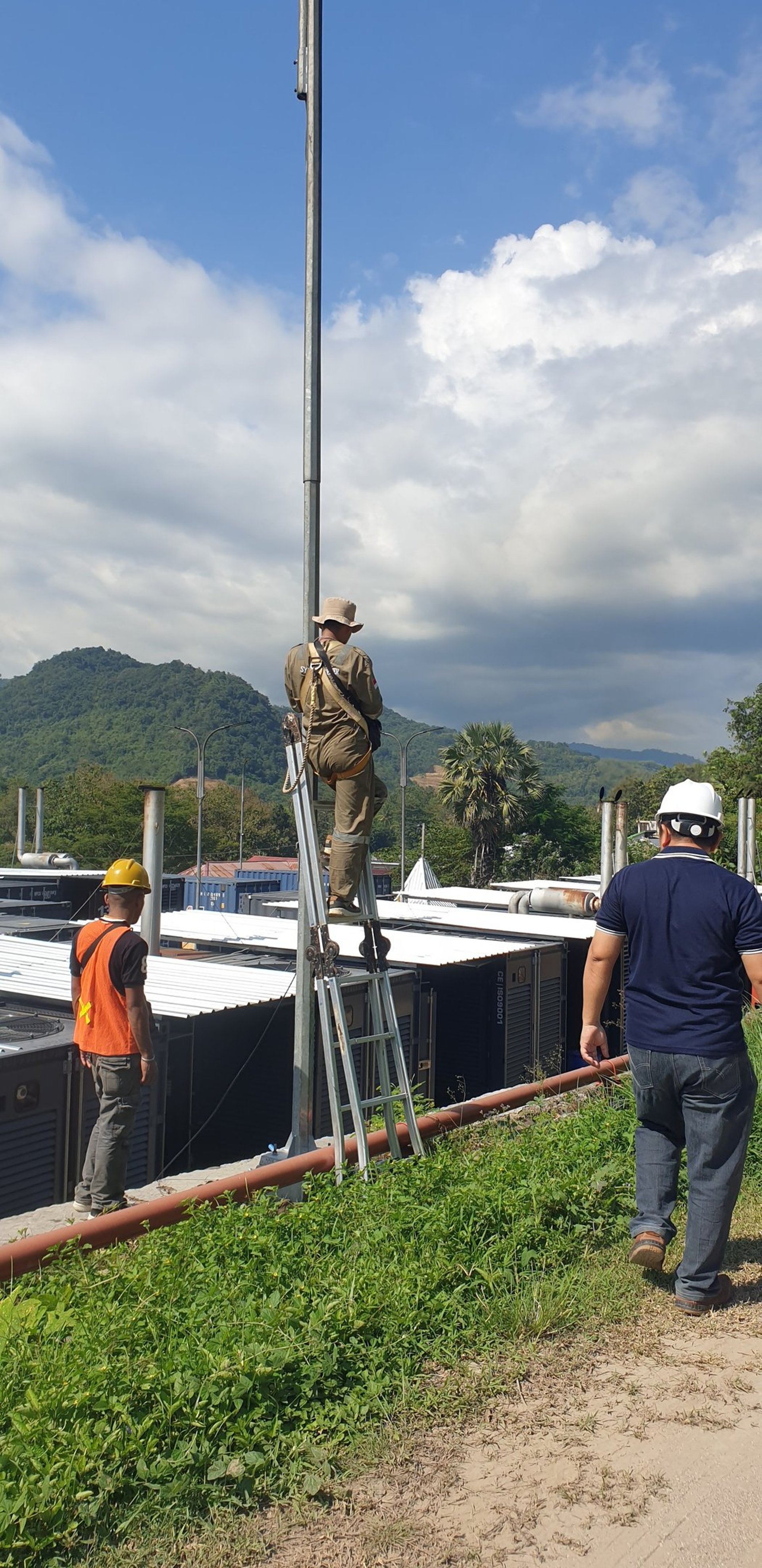 woman wearing yellow long-sleeved dress under white clouds and blue sky during daytime