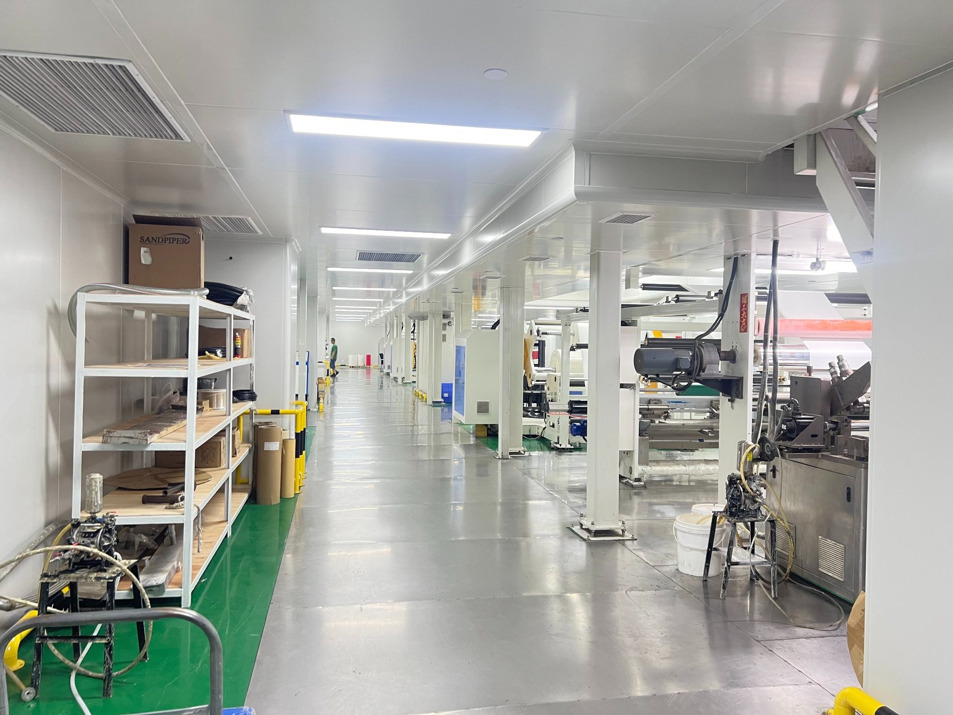 an abstract photo of a curved building with a blue sky in the background