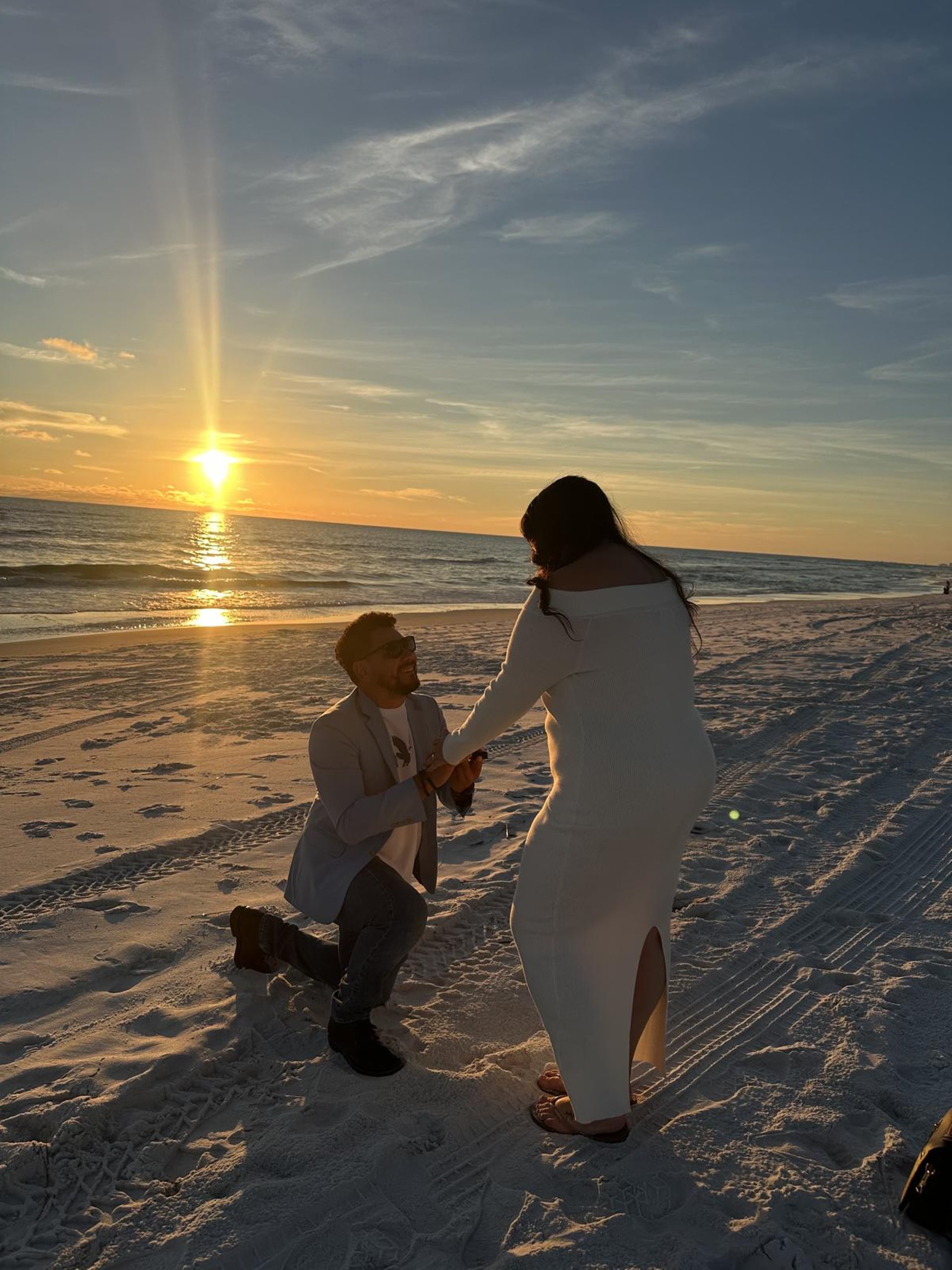 couple wearing silver-colored rings