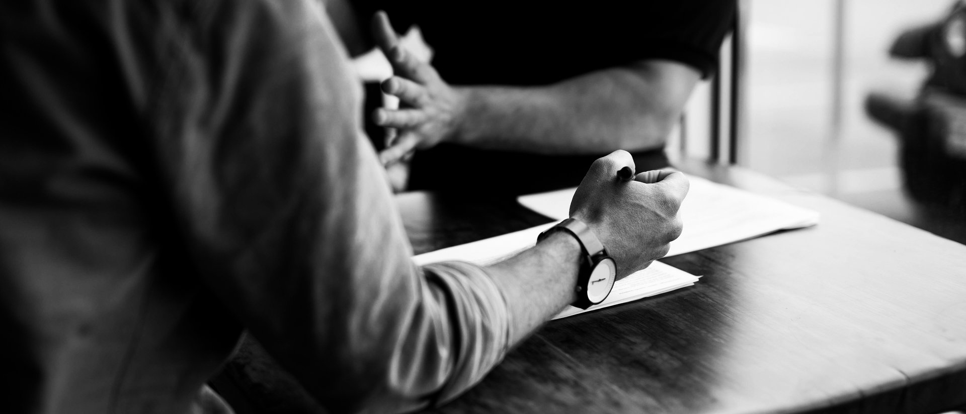 an abstract photo of a curved building with a blue sky in the background