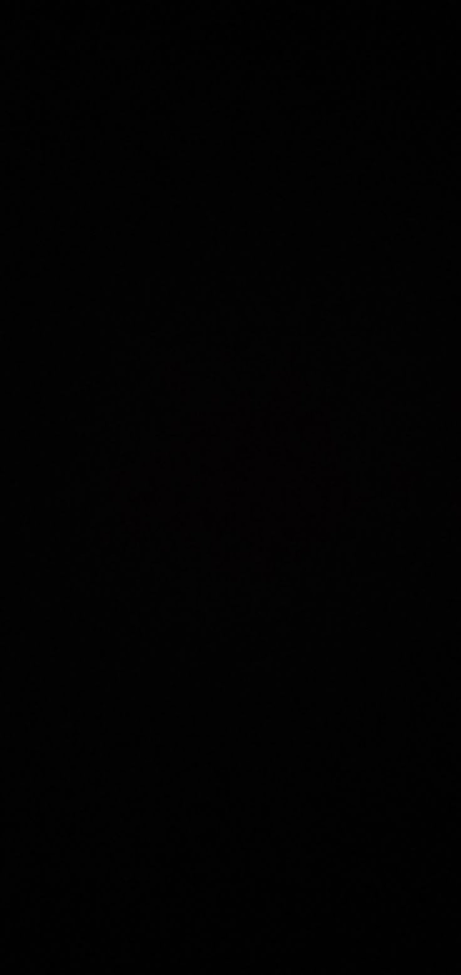 a black and white photo of a person laying on a bed