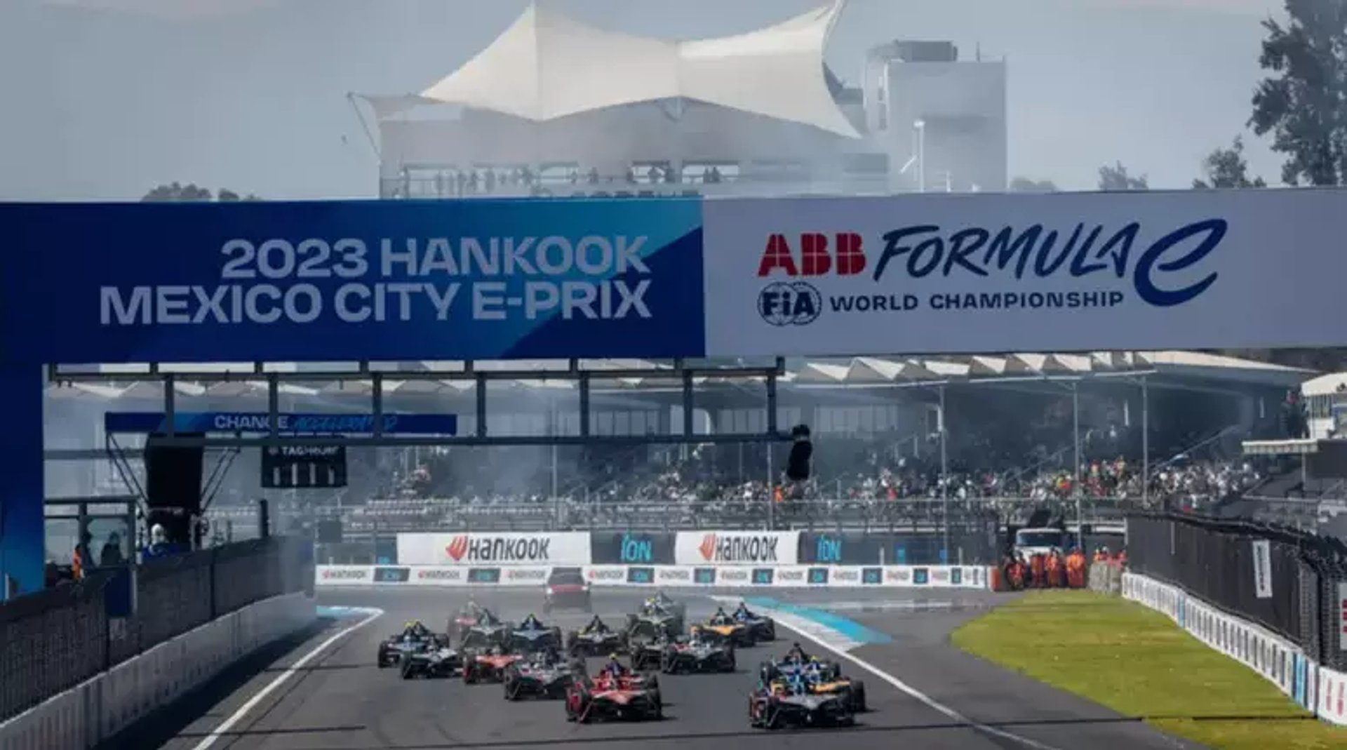 a blue car driving down a race track