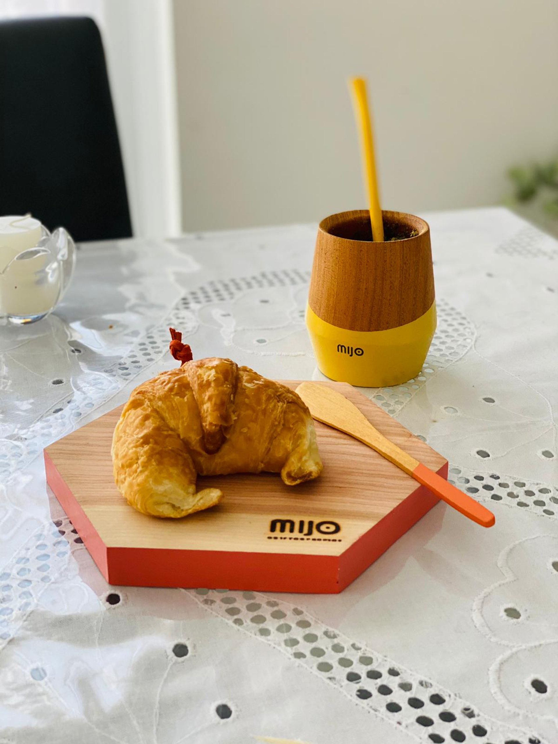 white ceramic mug on brown wooden table