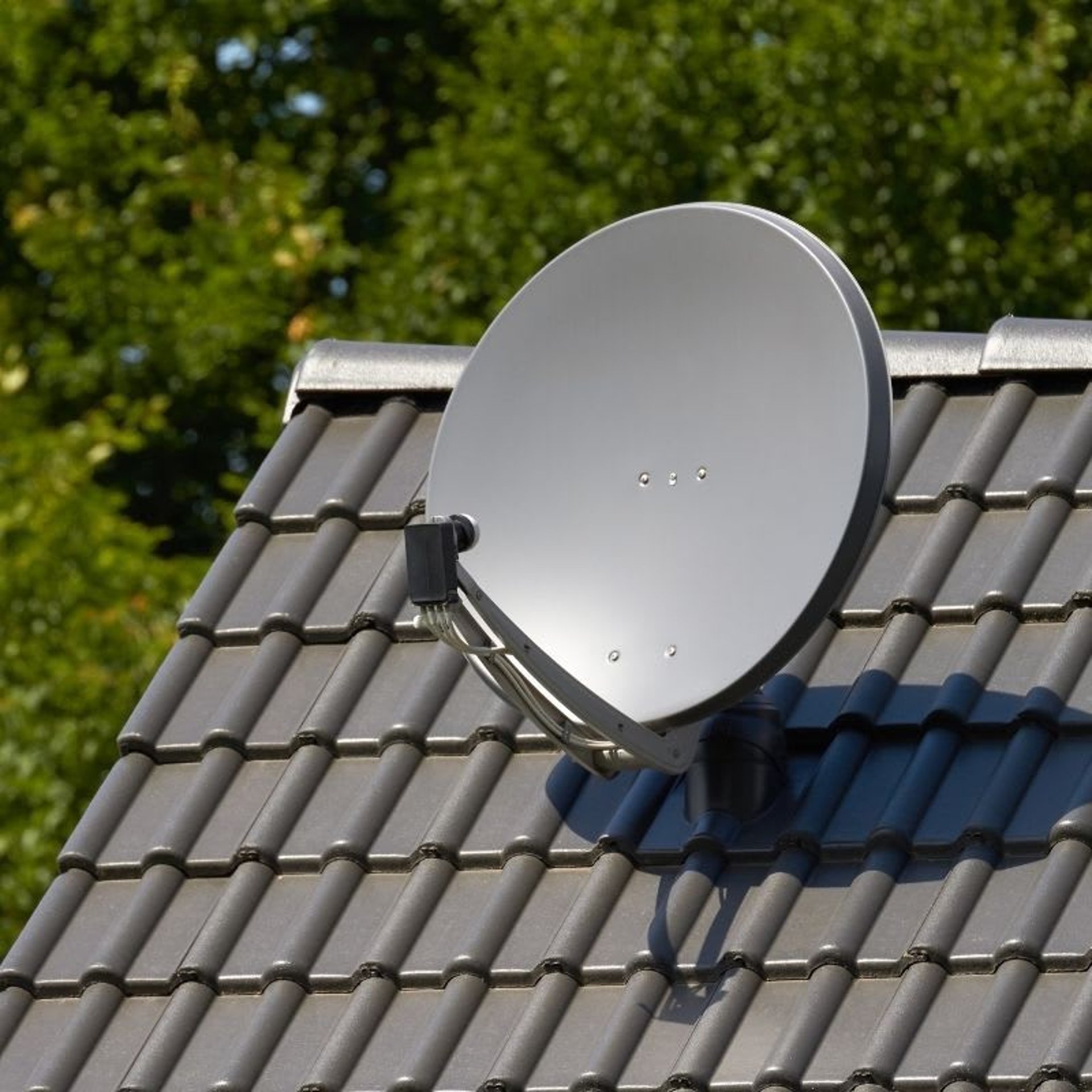 a living room with a flat screen tv and speakers