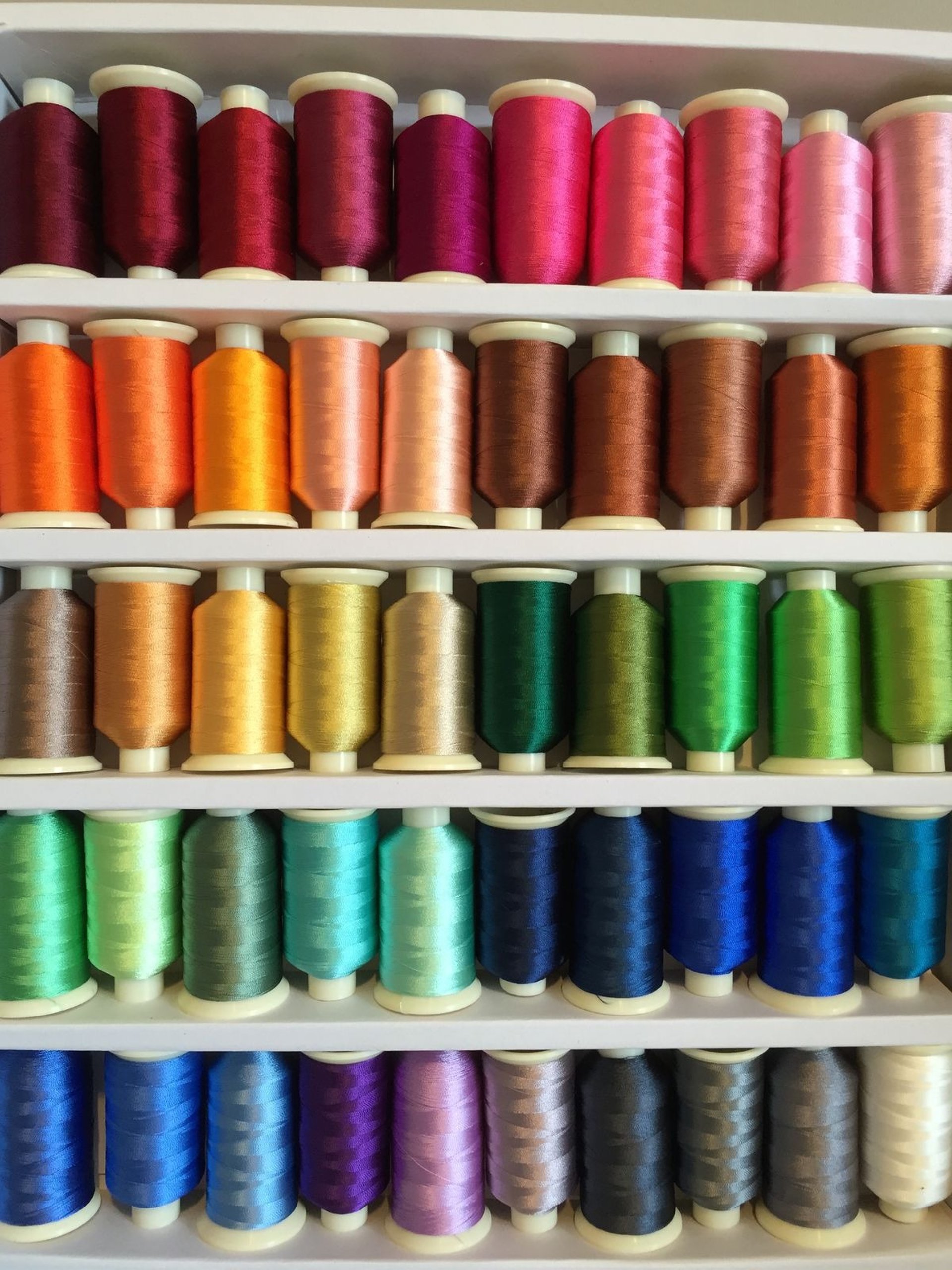 a group of different colored tubes