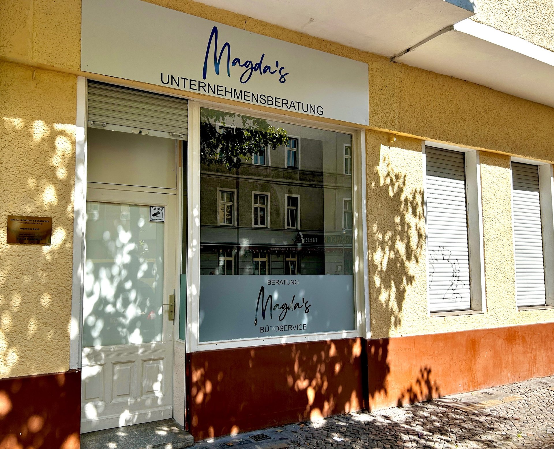 an abstract photo of a curved building with a blue sky in the background