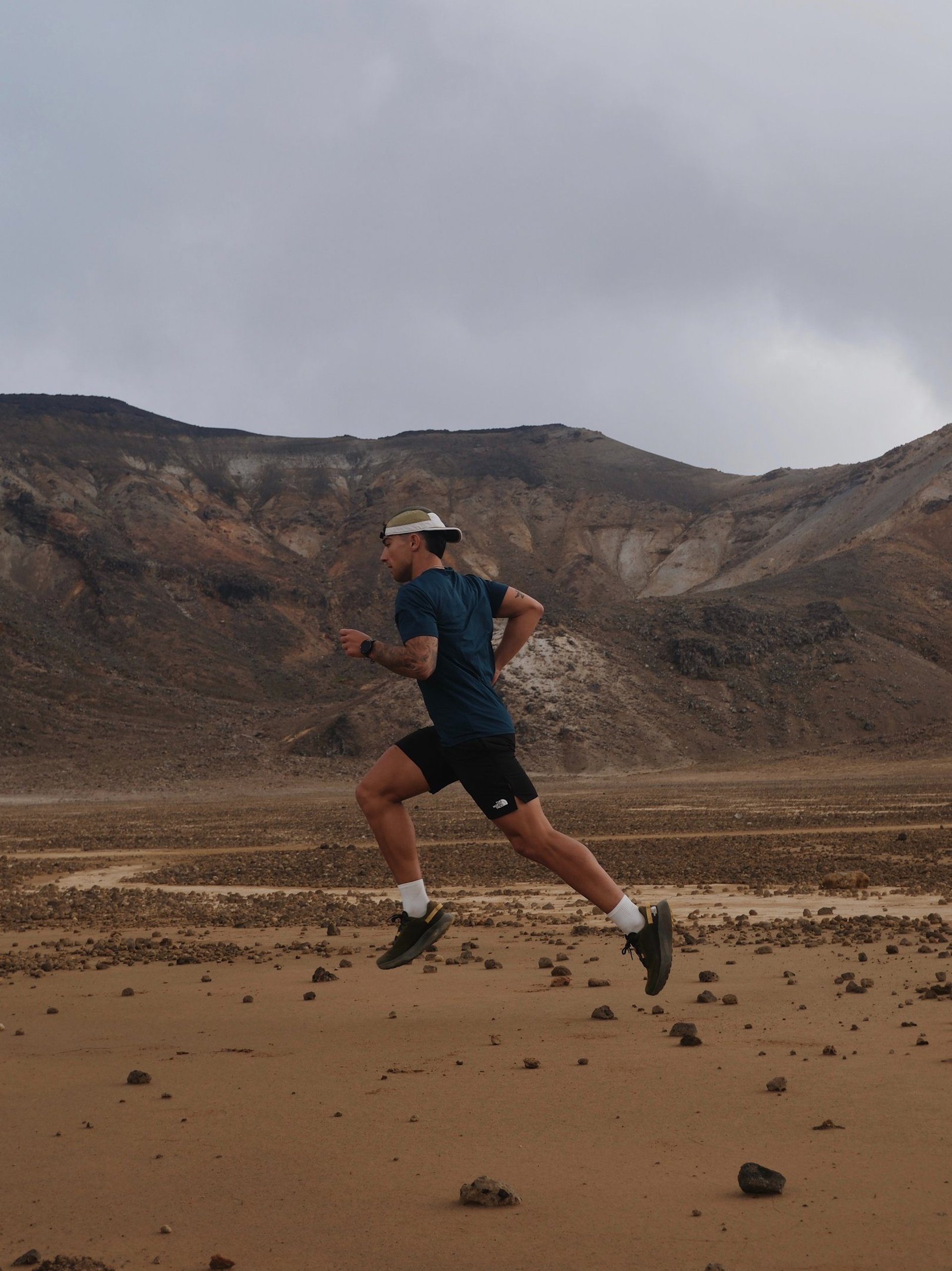 an abstract photo of a curved building with a blue sky in the background
