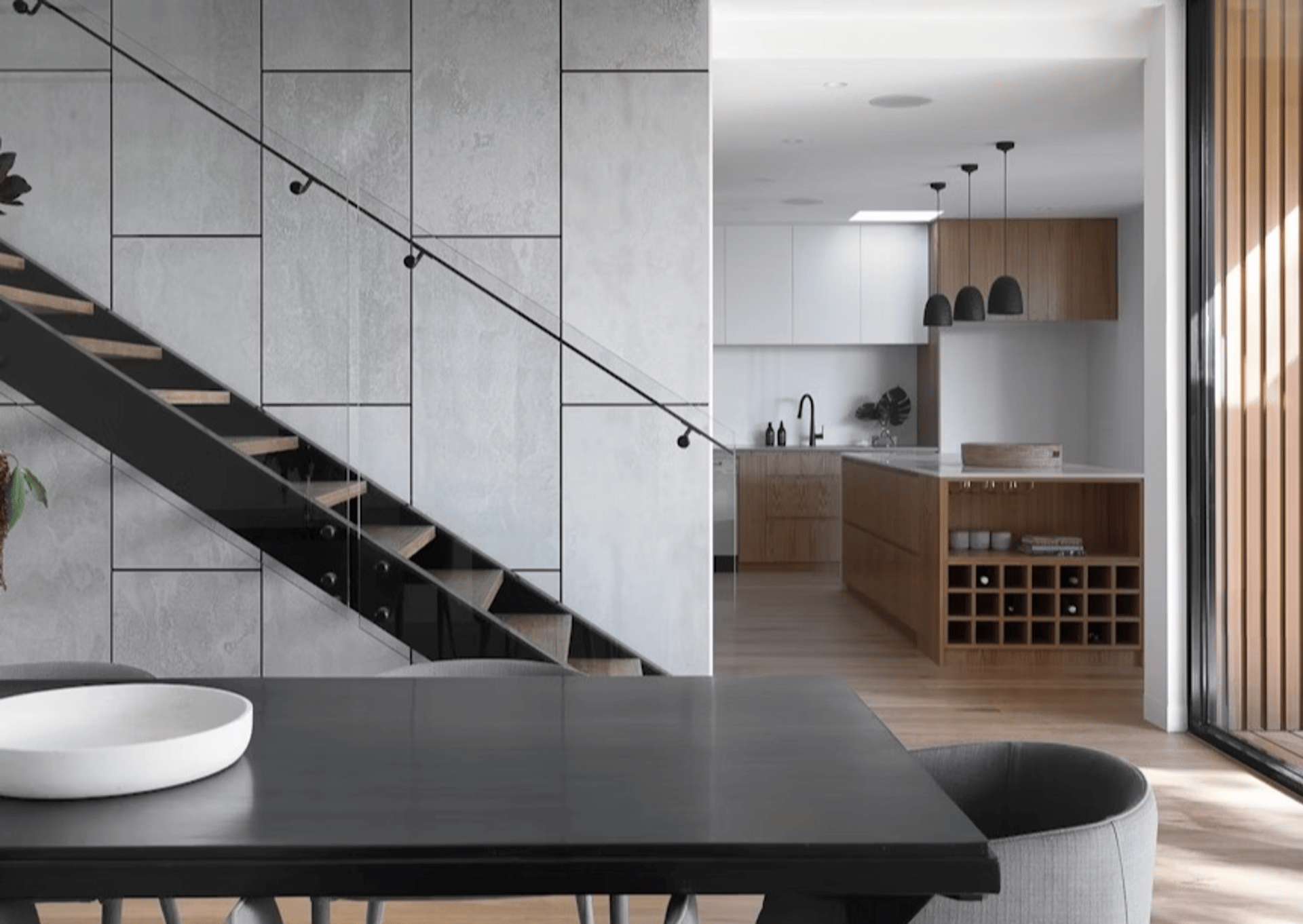 a dining room with a table, chairs, and a bench