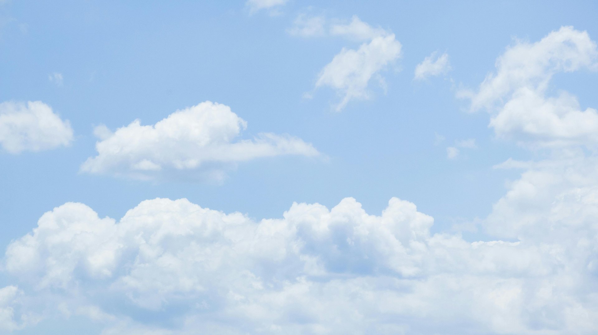 a large body of water with a boat in the distance