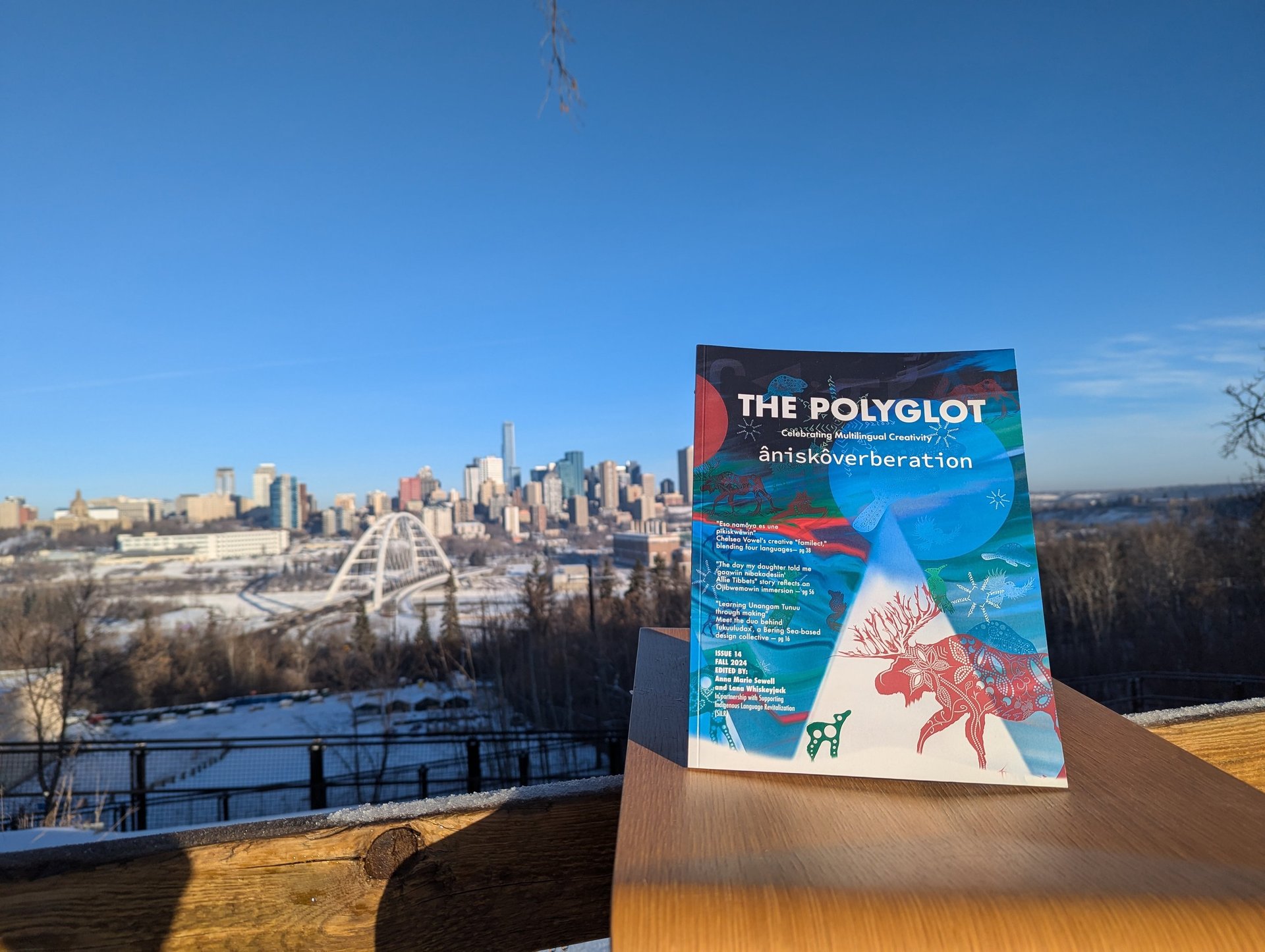 an abstract photo of a curved building with a blue sky in the background