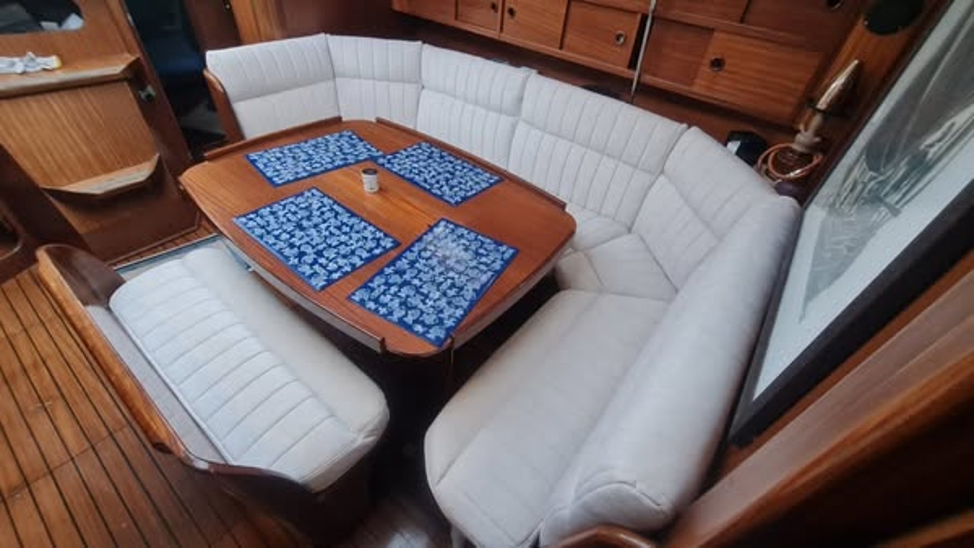 woman wearing yellow long-sleeved dress under white clouds and blue sky during daytime