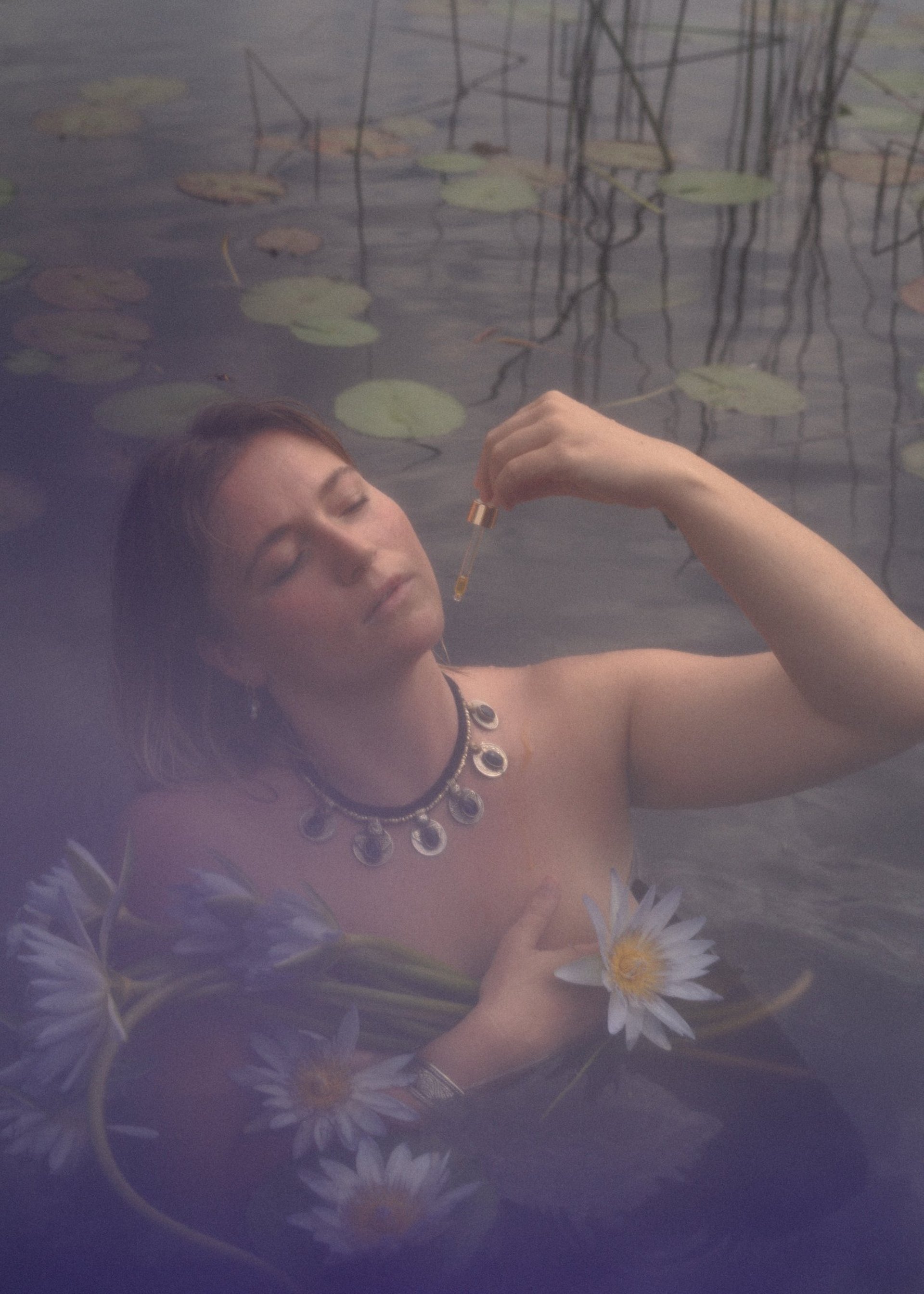 shallow focus photography of green lotus on body of water