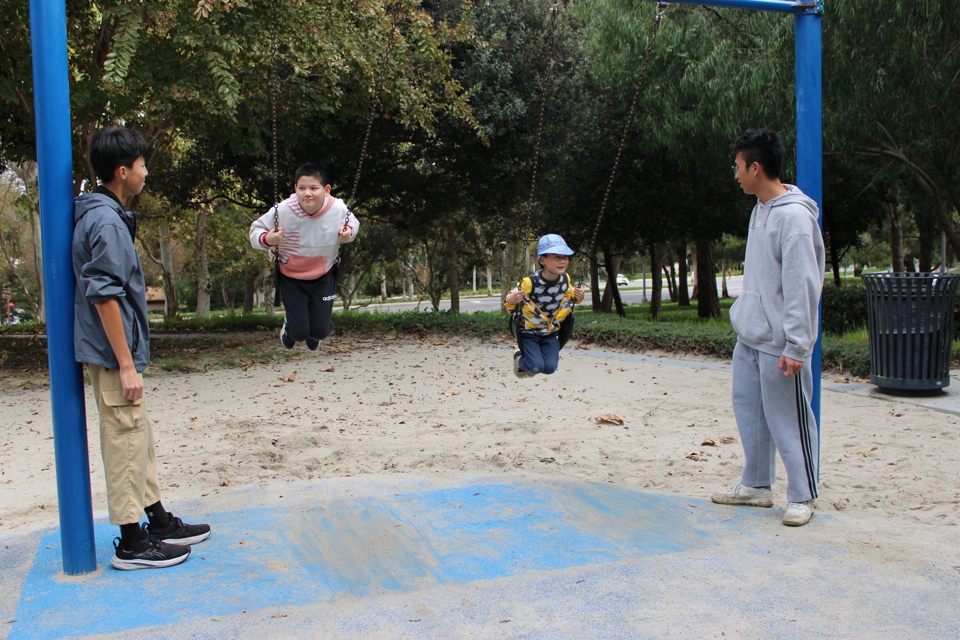 group of women standing on green grass field during daytime