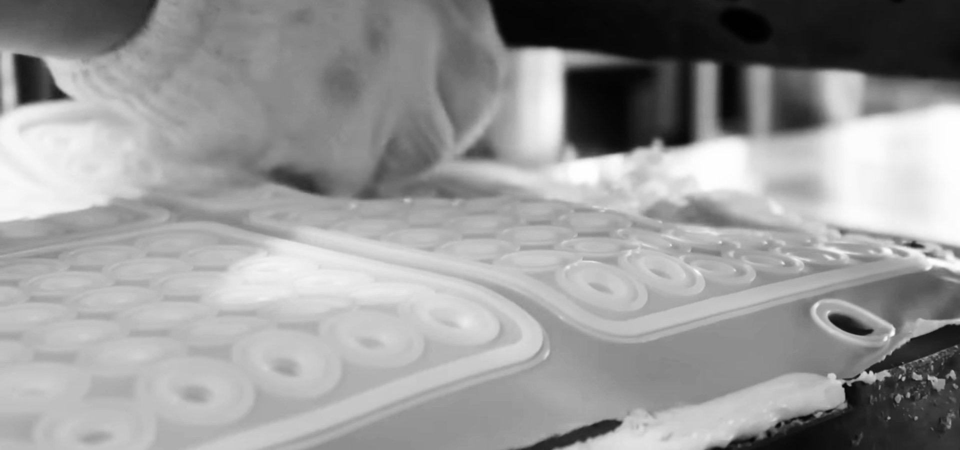 an abstract photo of a curved building with a blue sky in the background