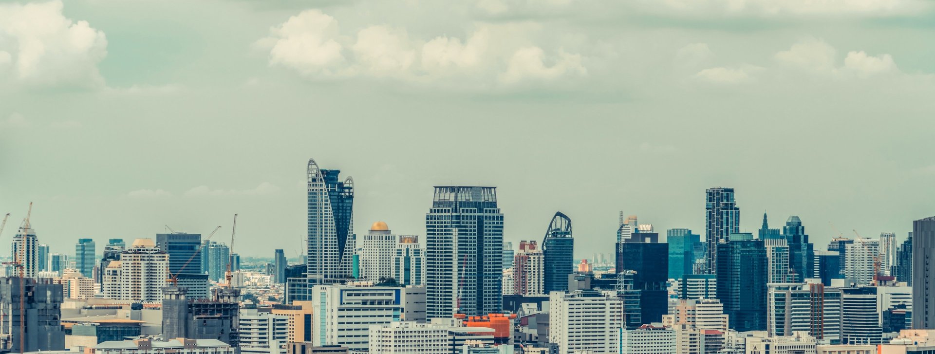 low angle photo of city high rise buildings during daytime