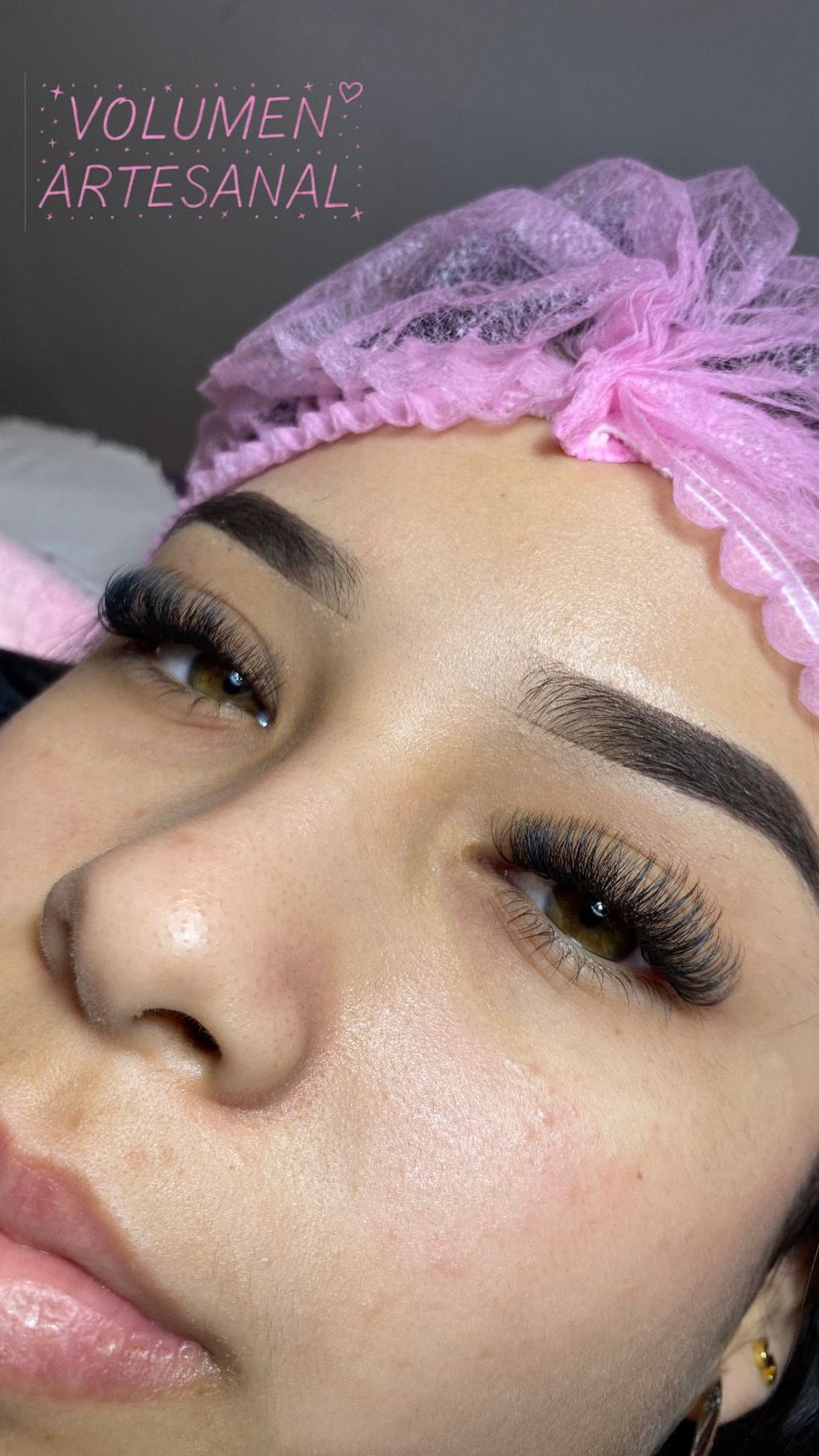 a woman's hands with white manicures and a ring