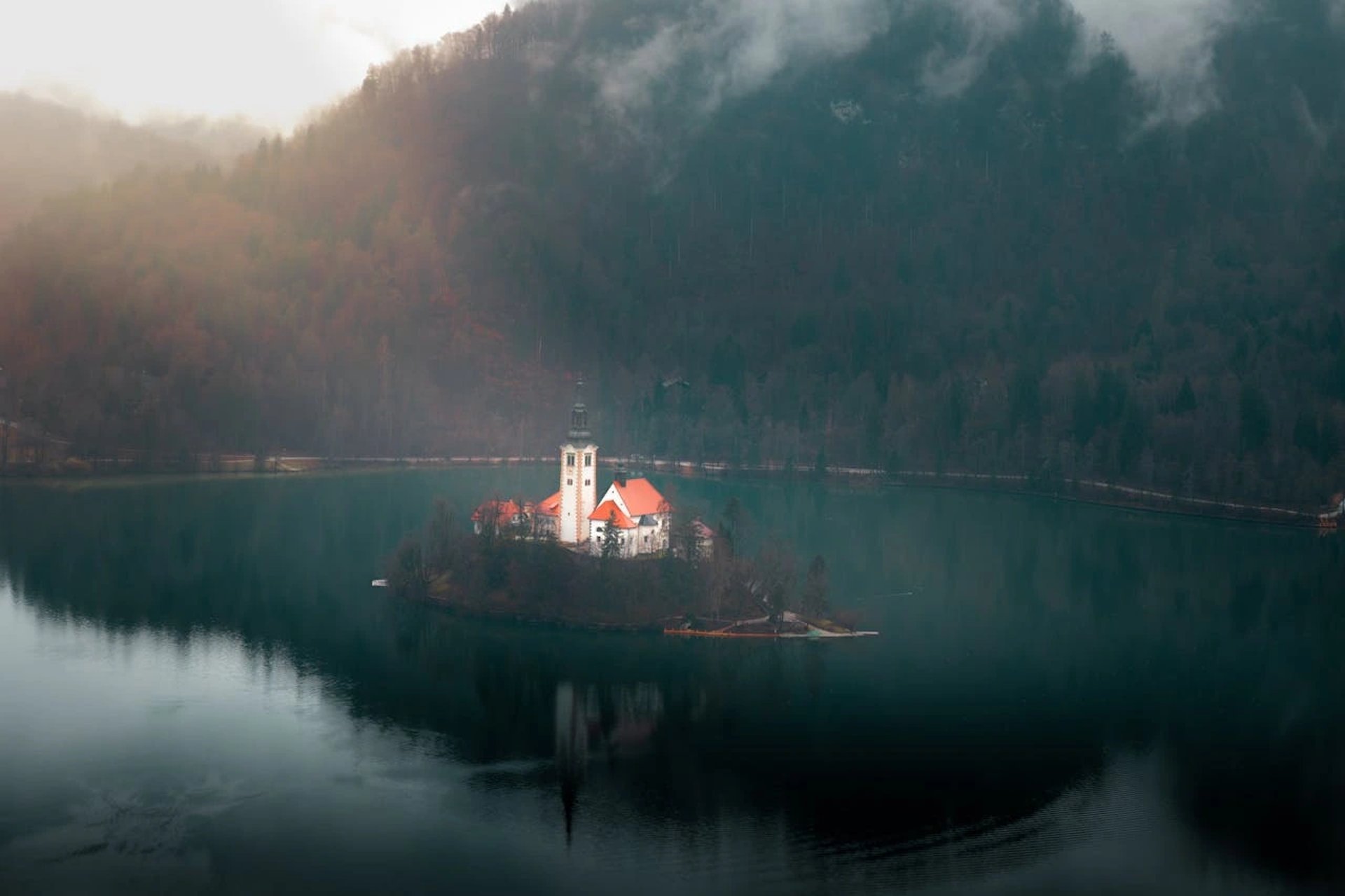 an abstract photo of a curved building with a blue sky in the background