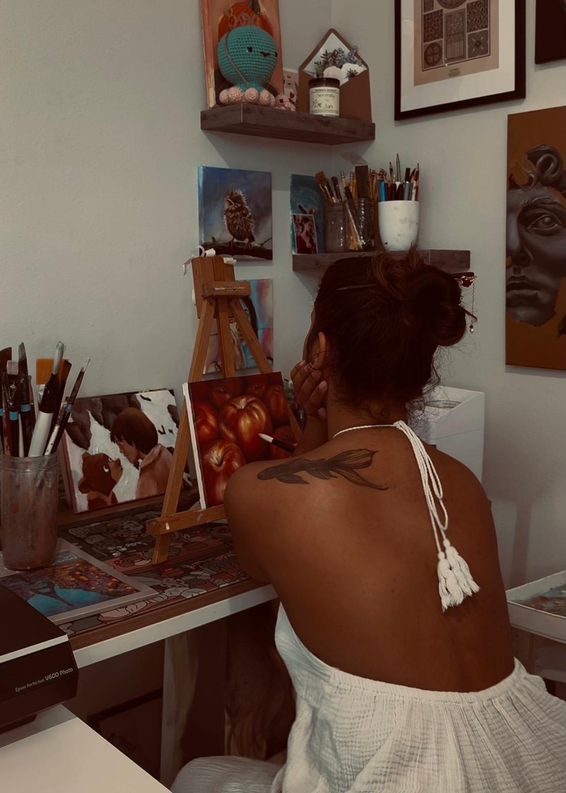 person wearing grey knit sweater