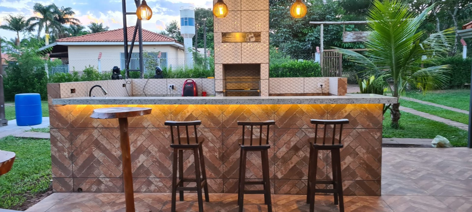 a swimming pool surrounded by palm trees and lawn chairs