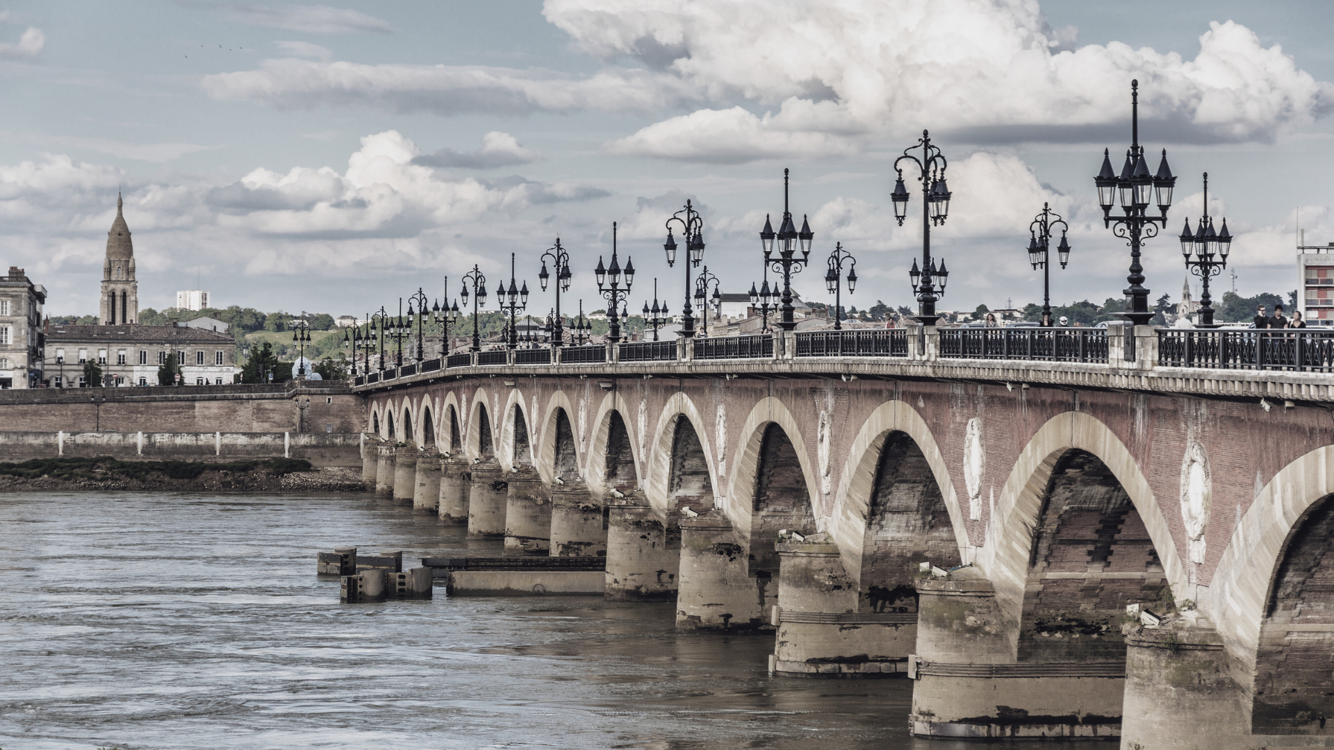 brown concrete bridge over river during night time